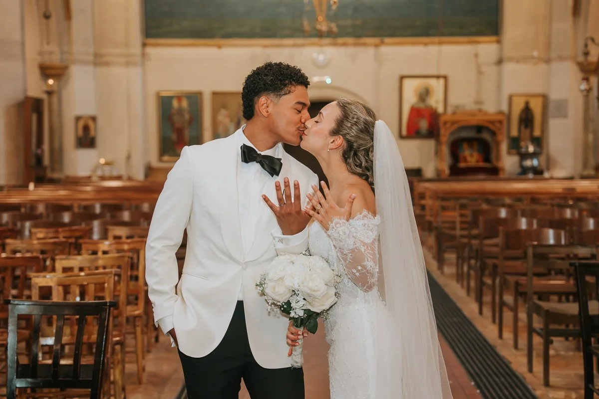  Newly married couple kissing inside the Greek Orthodox Church of Saint Nectarios in Battersea, London. 