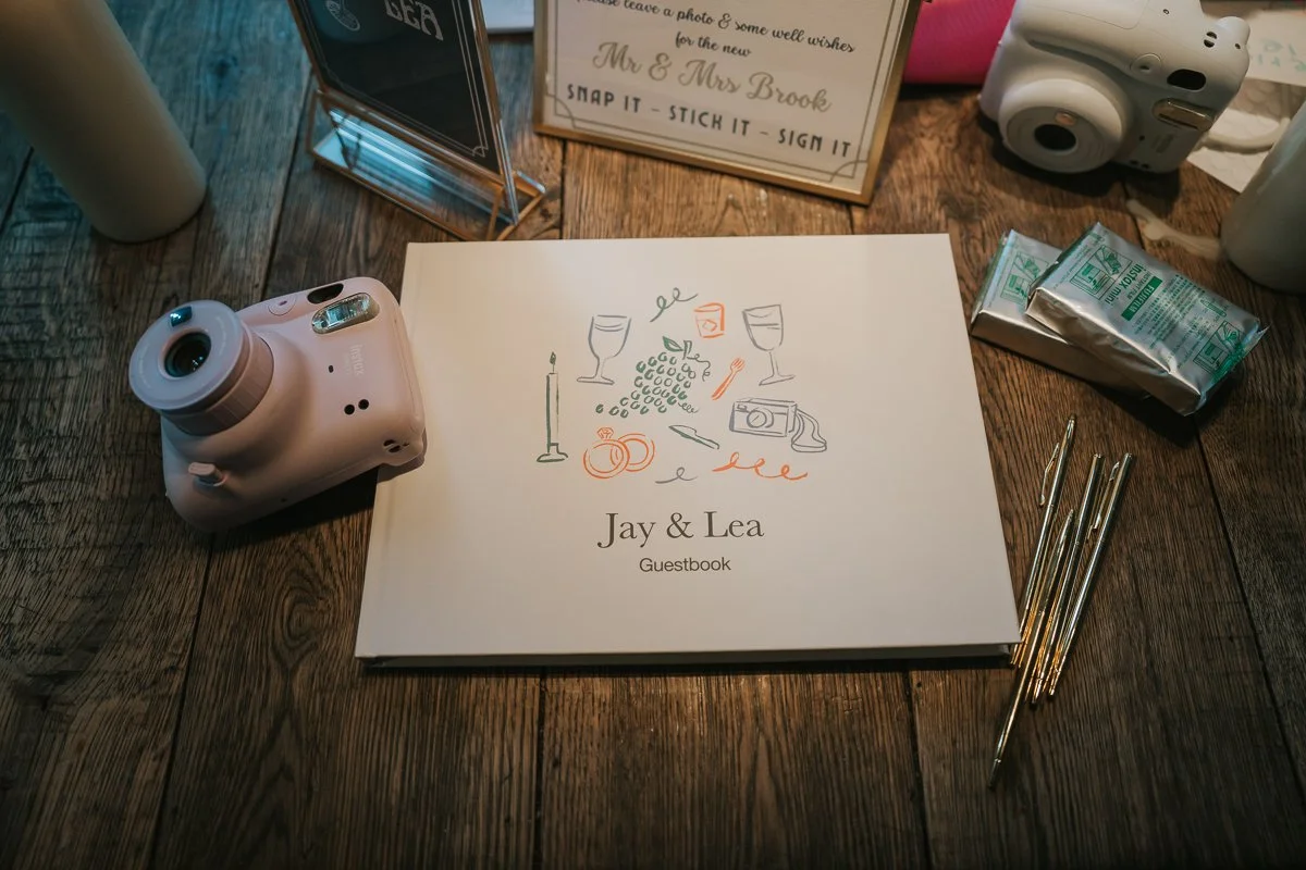  Wedding guest book with instant cameras ready for guests at a Balfour St Barts wedding reception. 