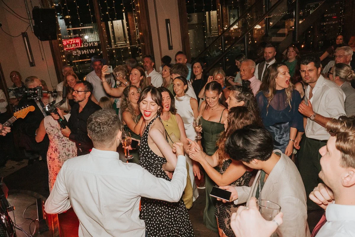  Packed dance floor during a lively wedding party at Balfour St Barts in Smithfield, London. 