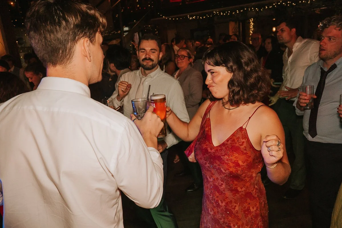   Wedding guests dancing and celebrating during the evening reception at Balfour St Barts.  