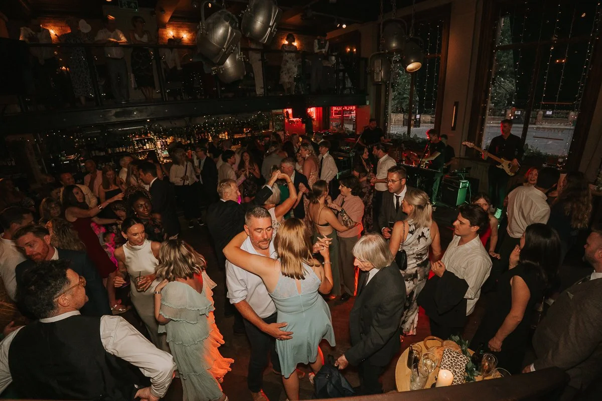  Busy evening dance floor at a Balfour St Barts wedding reception in Smithfield, London. 