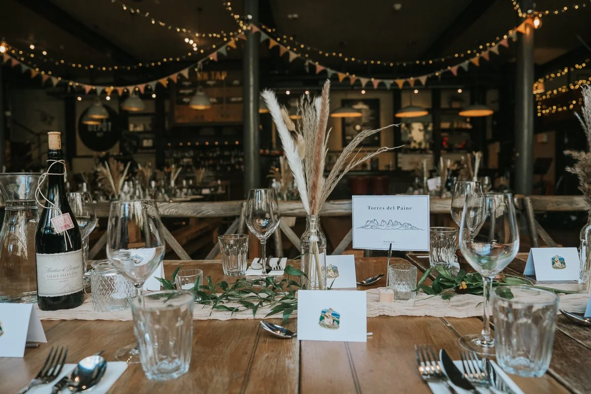  Rustic wedding reception table decor with dried flowers and greenery inside The Depot in Islington, London. 