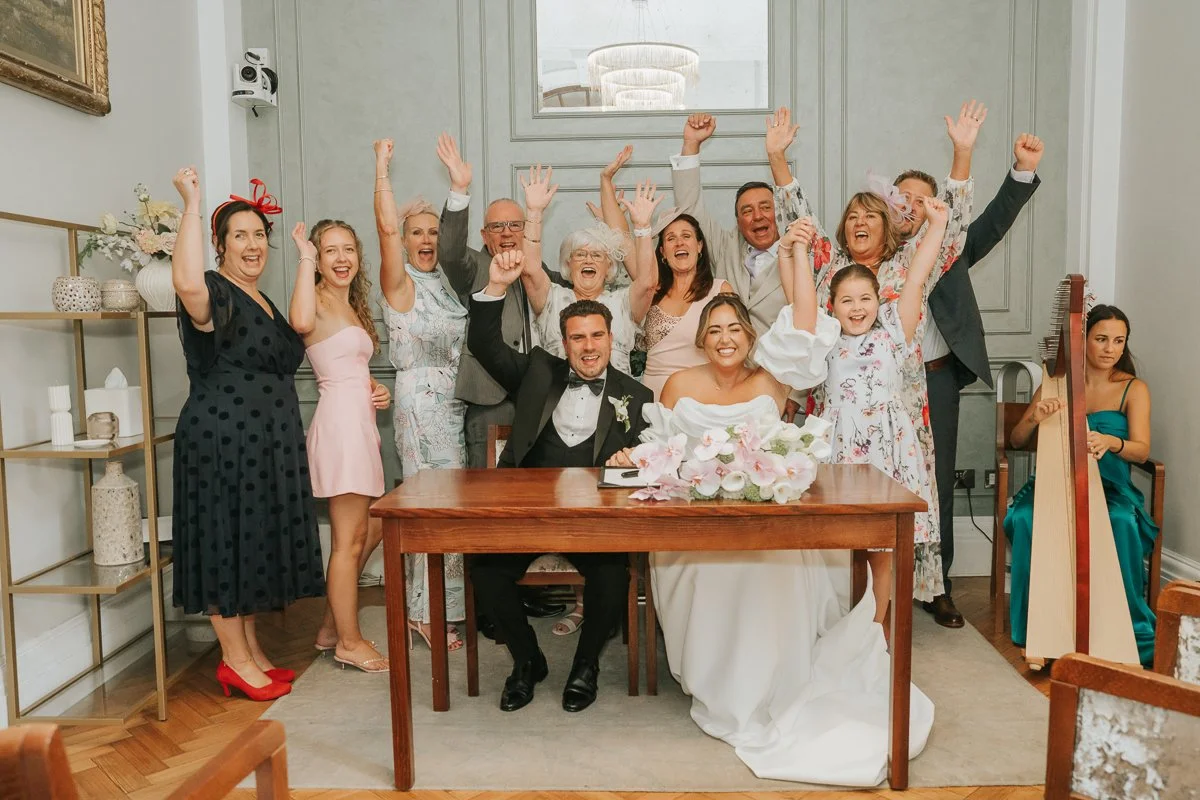  Chelsea Old Town Hall wedding photography of the newlyweds celebrating with family and friends after their ceremony. 