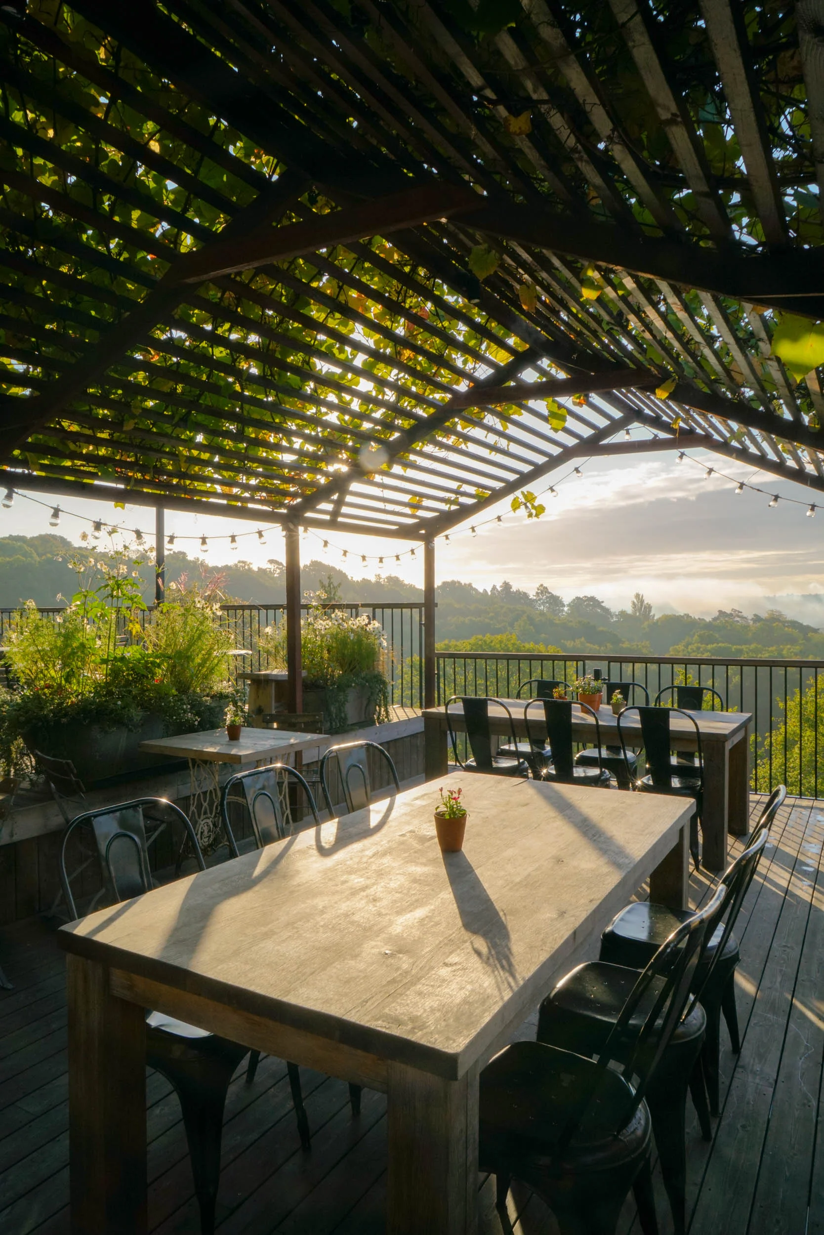 The dining tables and a view out across the valley at The Beacon, Tunbridge Wells, Kent.