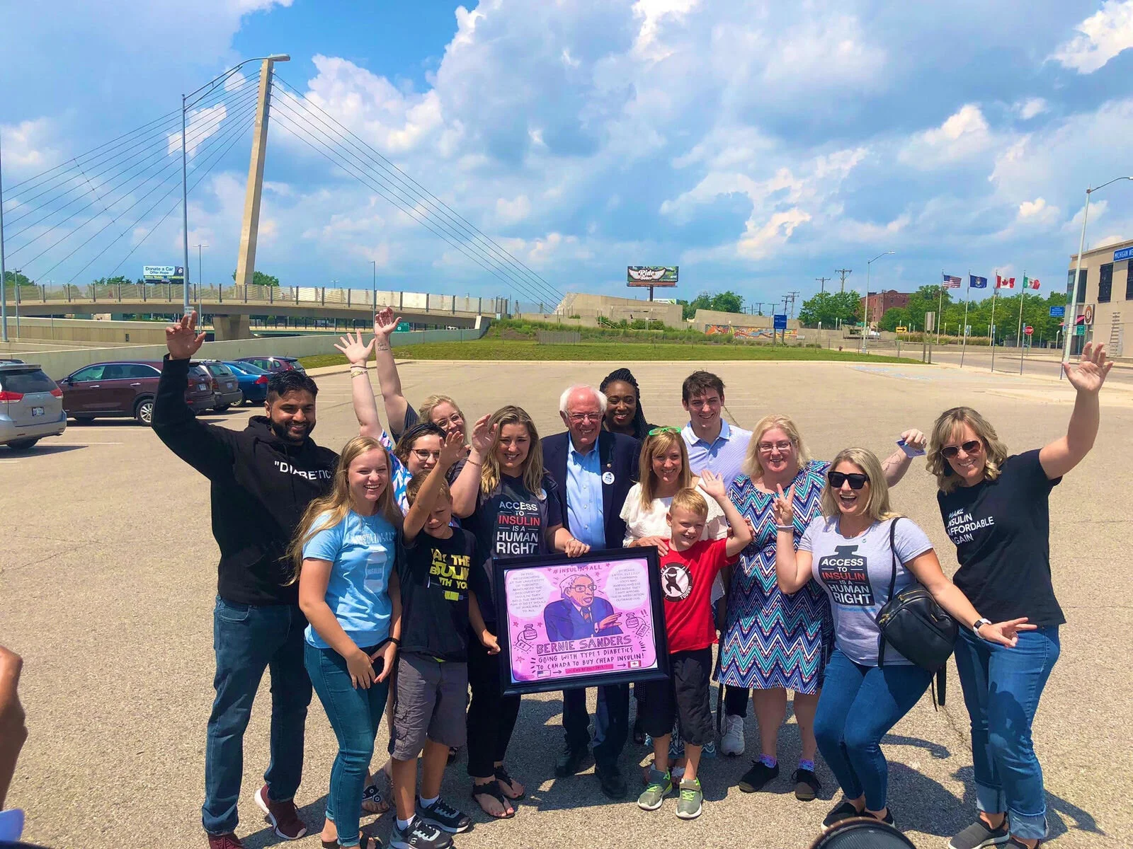 Janina's artwork is presented to Bernie Sanders.