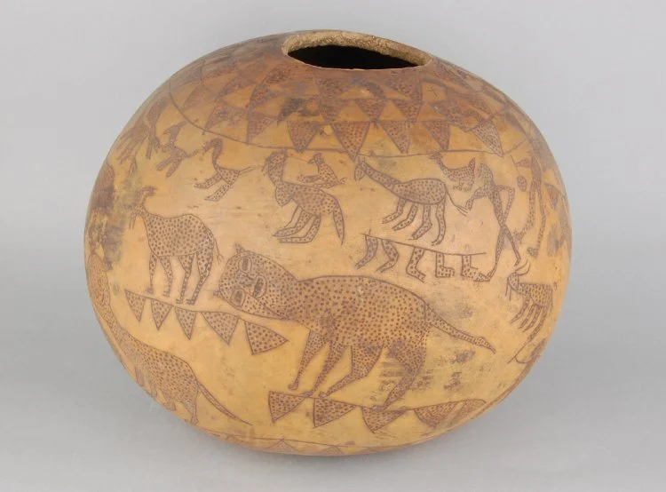 Source: Gourd vessel, subspherical, decorated with incised human and animal figures, Tesoland, eastern Uganda, ca. 1939 (British Museum Af1939,25.10)