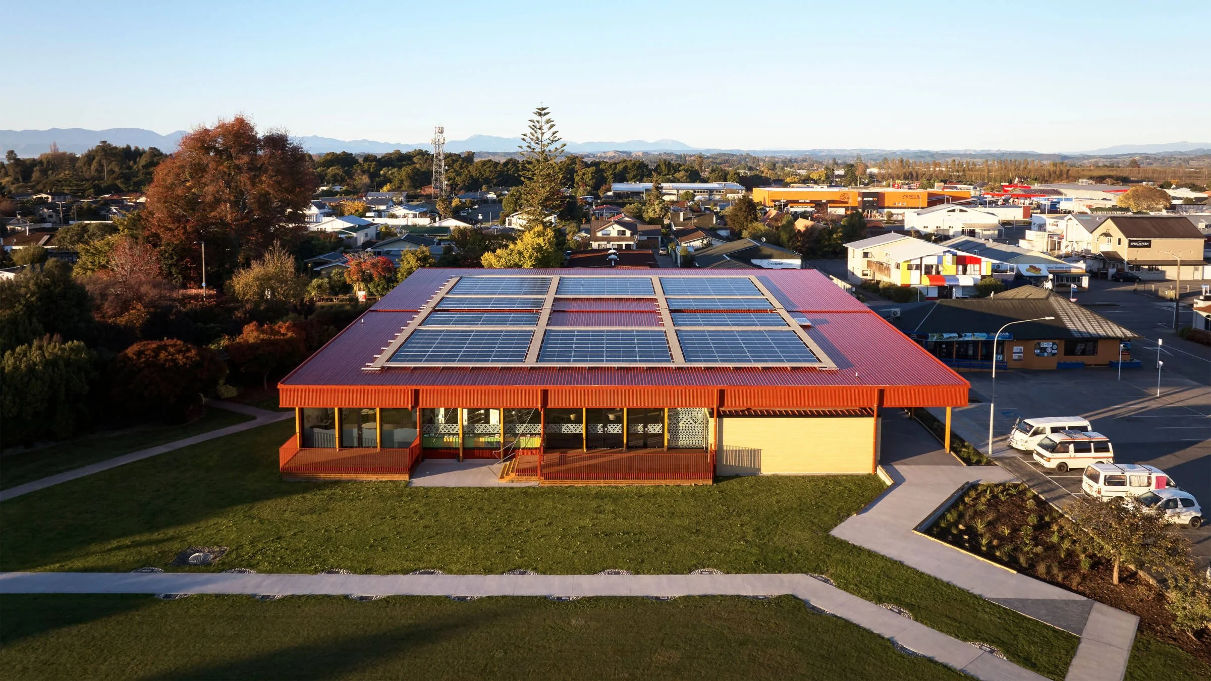 Esolar rooftop solar array on Te Noninga Kumanu Motueka Library in Tasman, with panels across its red corrugated roof.