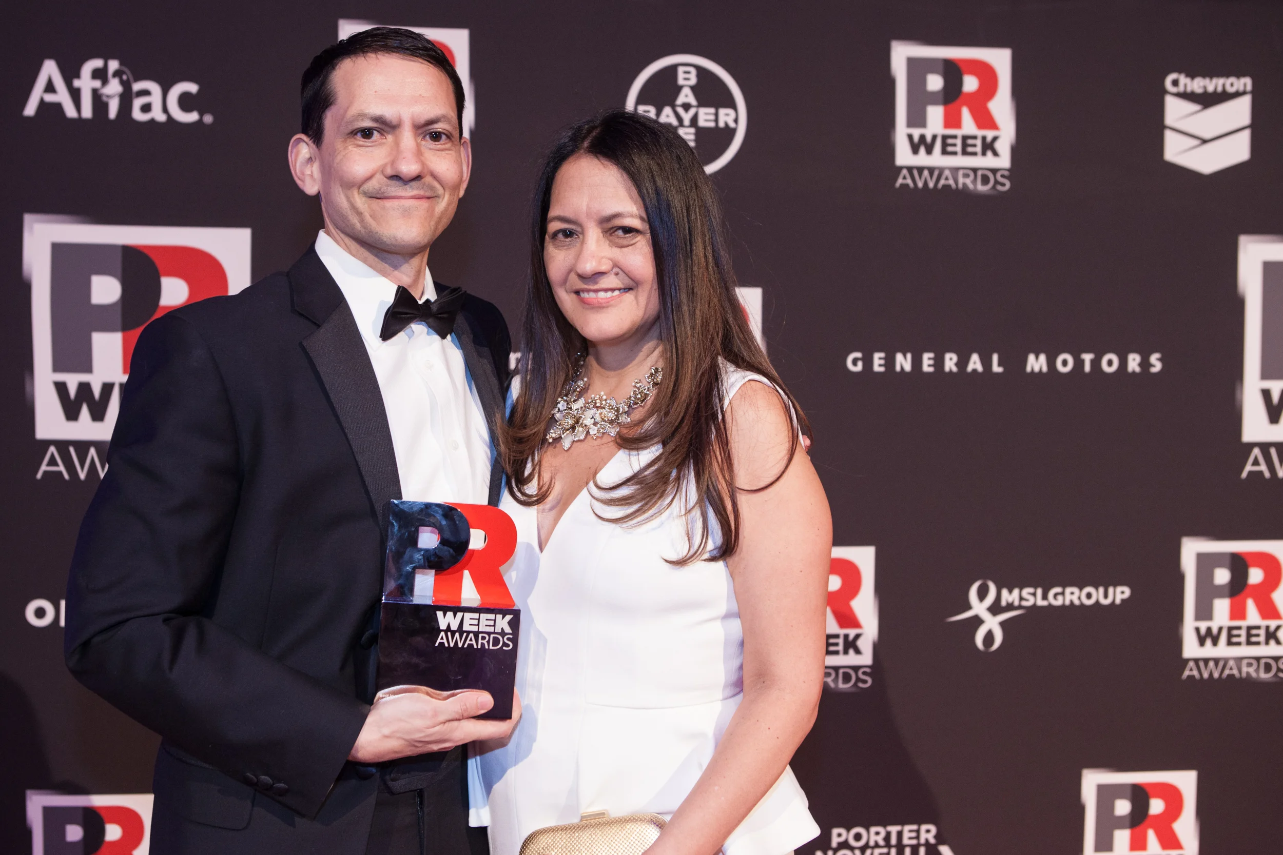 Camino team holding PR Week Award.