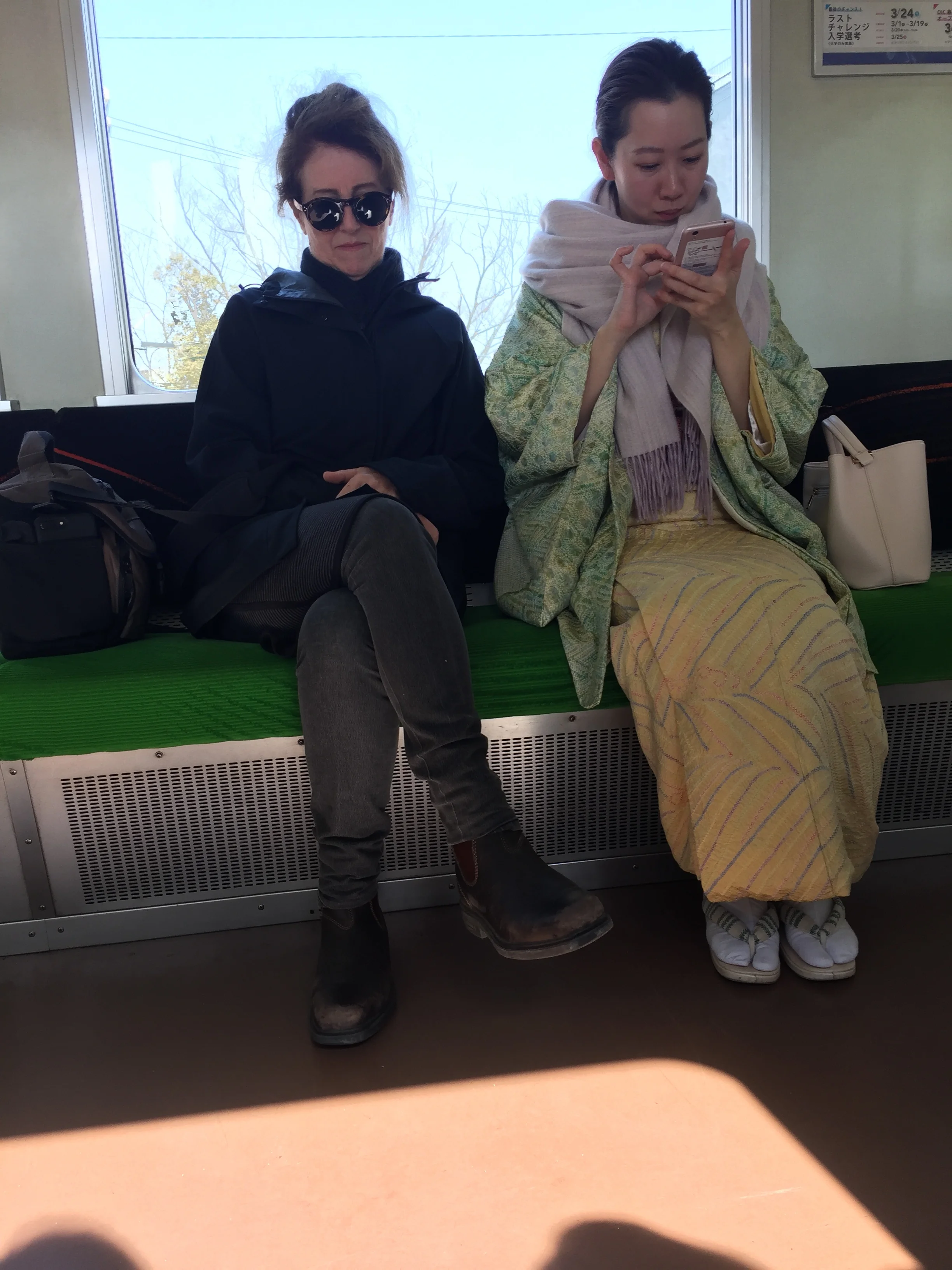 All this while Gillian is travelling through the Japanese countryside, looking CHIC AS next to her new friend.