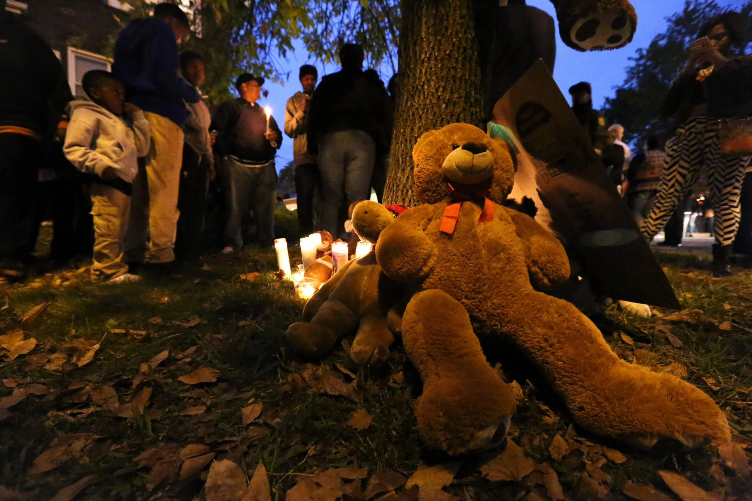 A memorial is formed in the front yard of 18-year-old Vonderrit Myers Jr., killed by an off-duty St. Louis police officer on October 8, 2014, just months after the killing of Michael Brown in Ferguson, MO.
