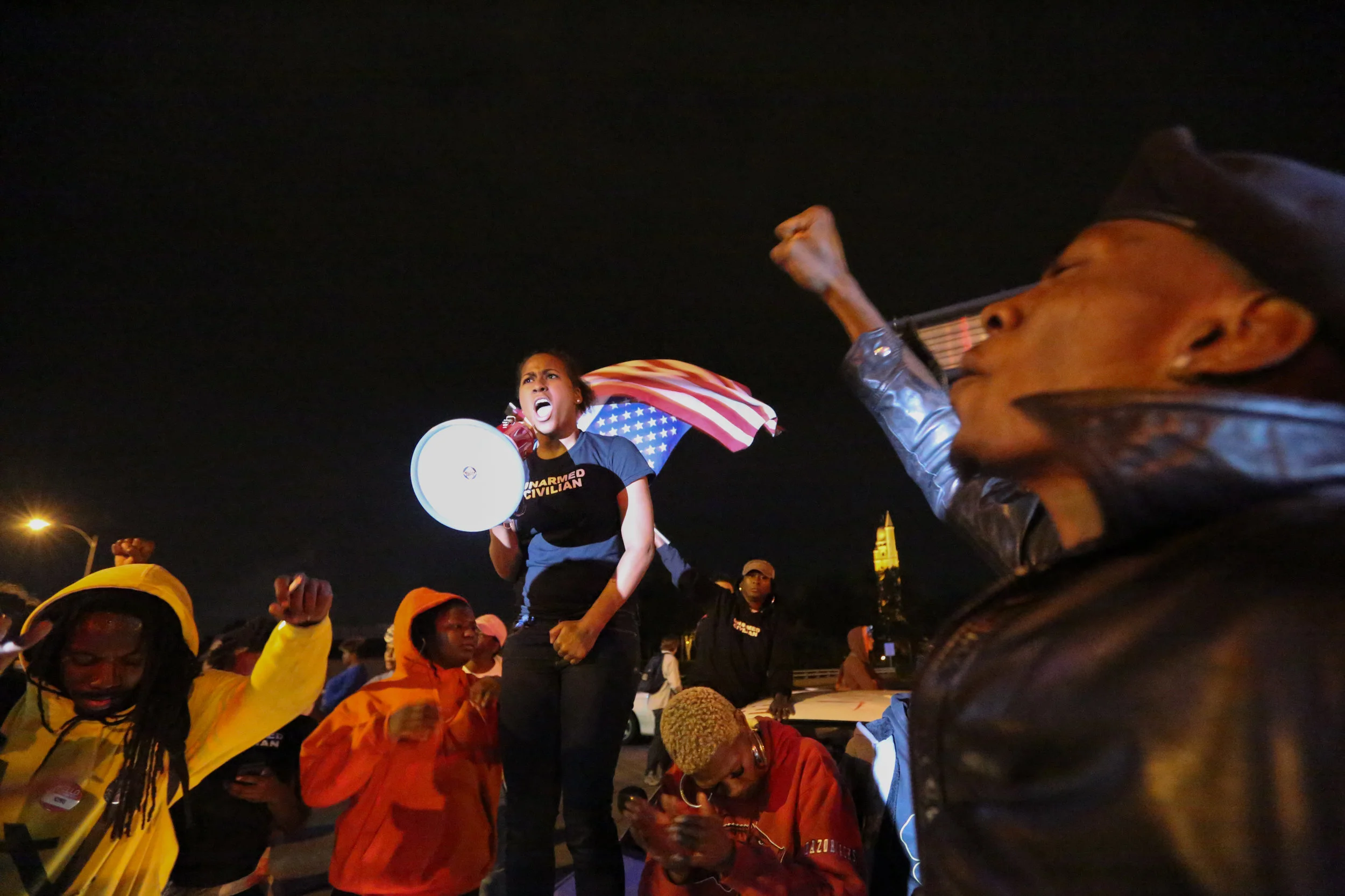 Alexis leads the crowd of hundreds in a chant of, “No justice – no peace!” as they shut down a major intersection in St. Louis, MO.