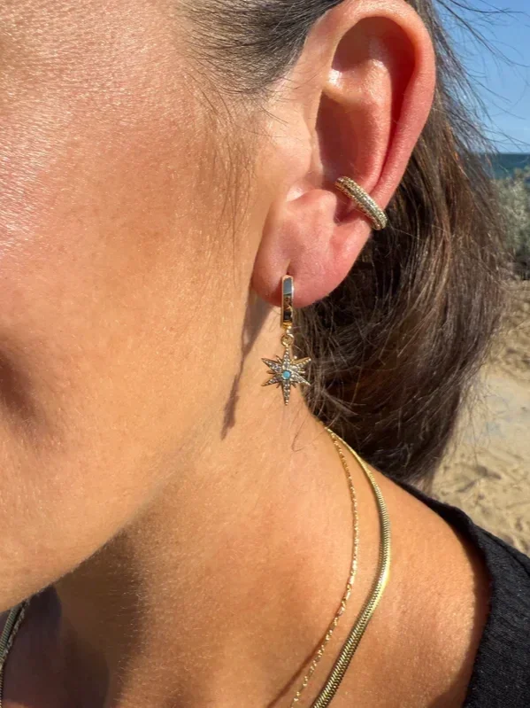 THE_TUNIK_NORTH_STAR_HUGGIE_EARRINGS_THE_TUNIK_MICRO_PAVE_EAR_CUFF_-_GOLD.webp