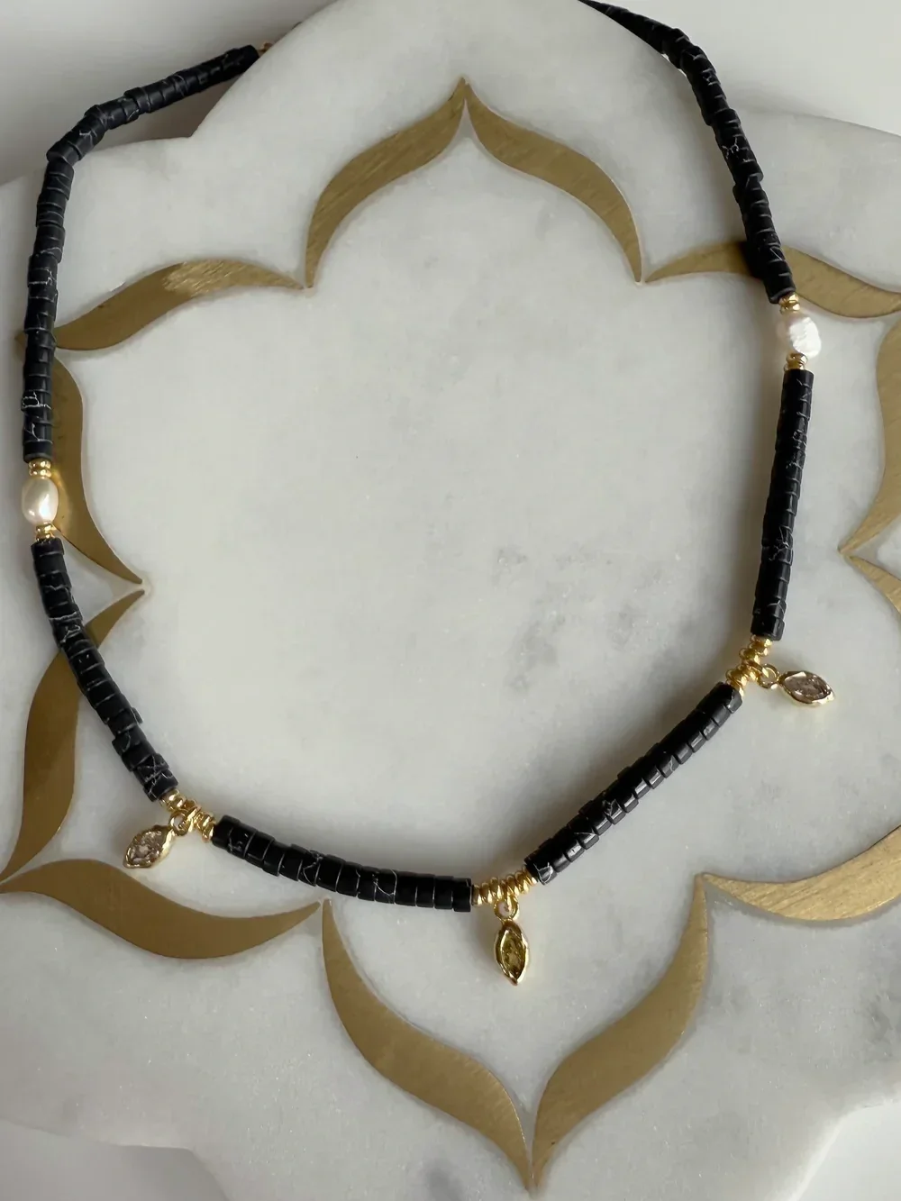 THETUNIKHEISHIBLACKNECKLACE2.webp