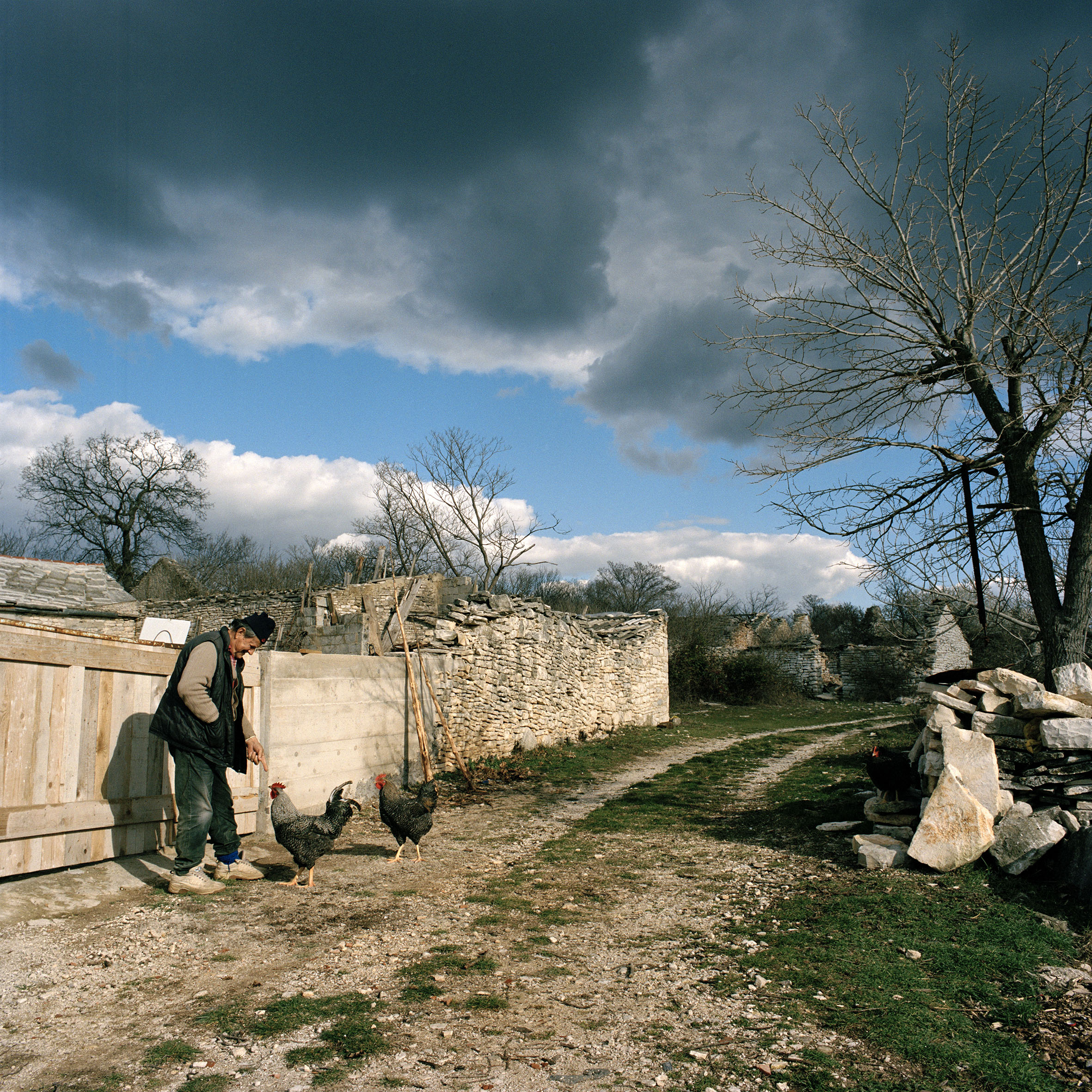  Branko Banic outside his house in Brgud, Sothern Croatia. He was born here and lived here all his life until being displaced to Serbia in 1995. Now he is home for good. 