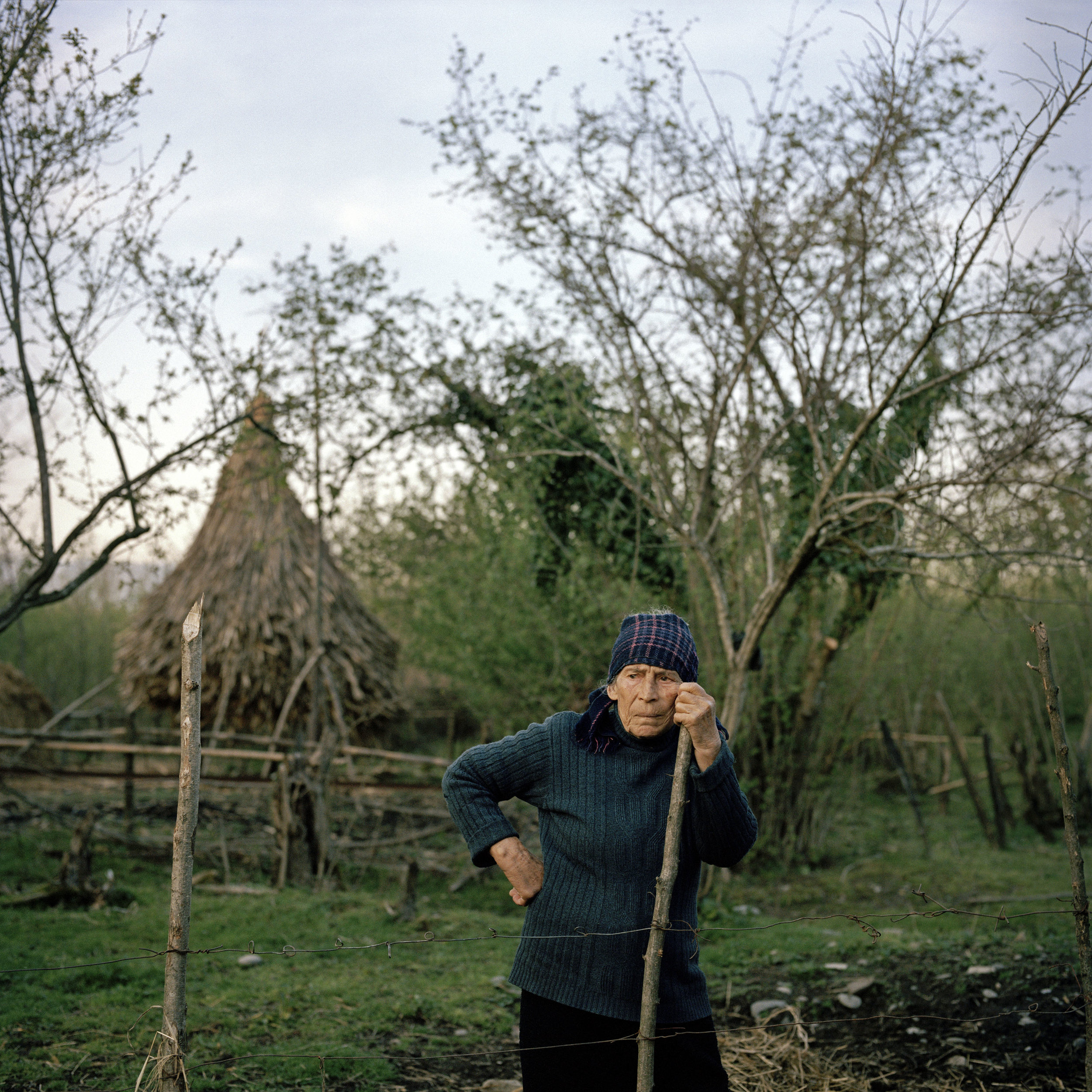 Lamara Shengelia, 78, takes a break from her work on the family farm in the village of Tagiloni.