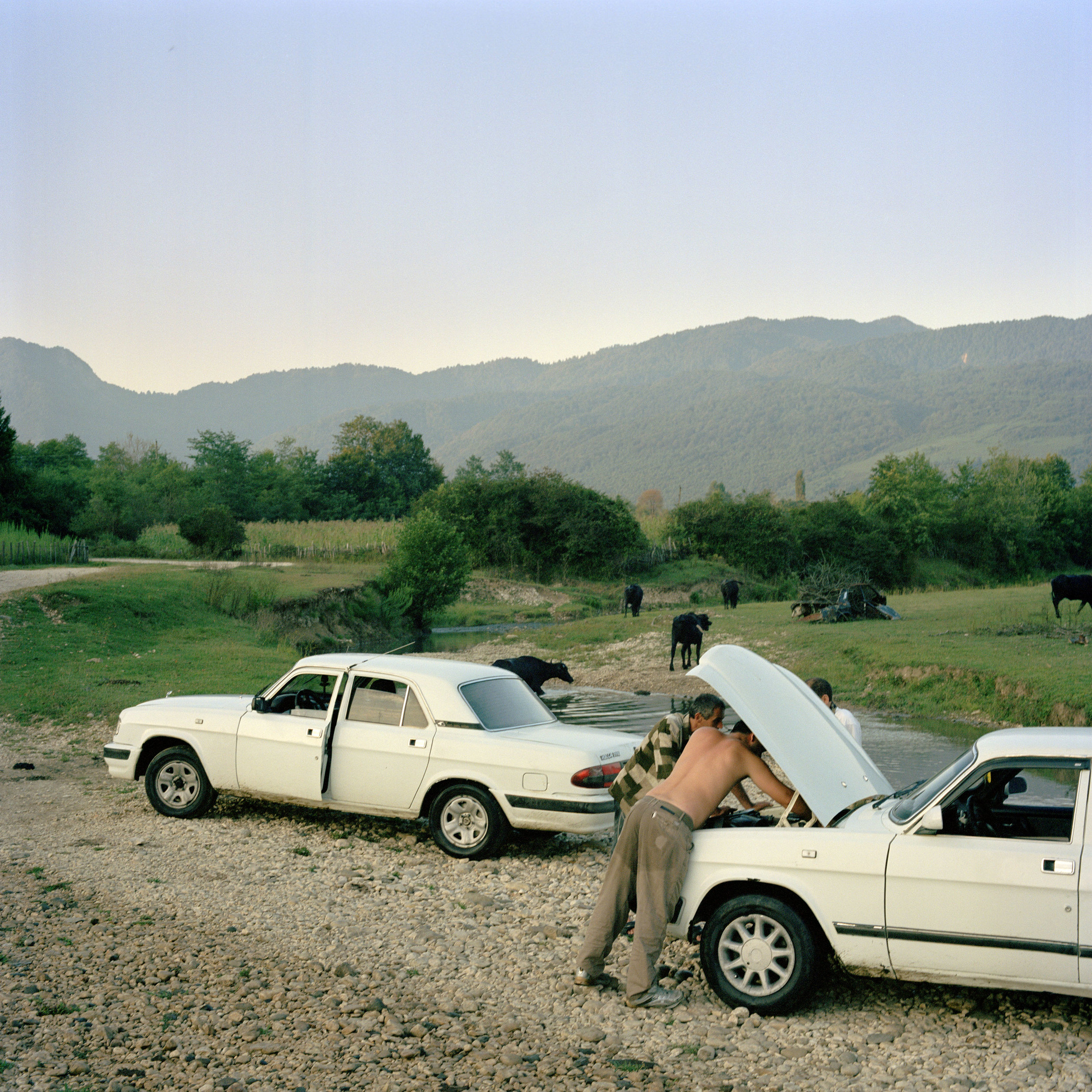 Zaza Katalandze and Tamas Jivanja stop to fix Zaza’s car after driving through a small river.