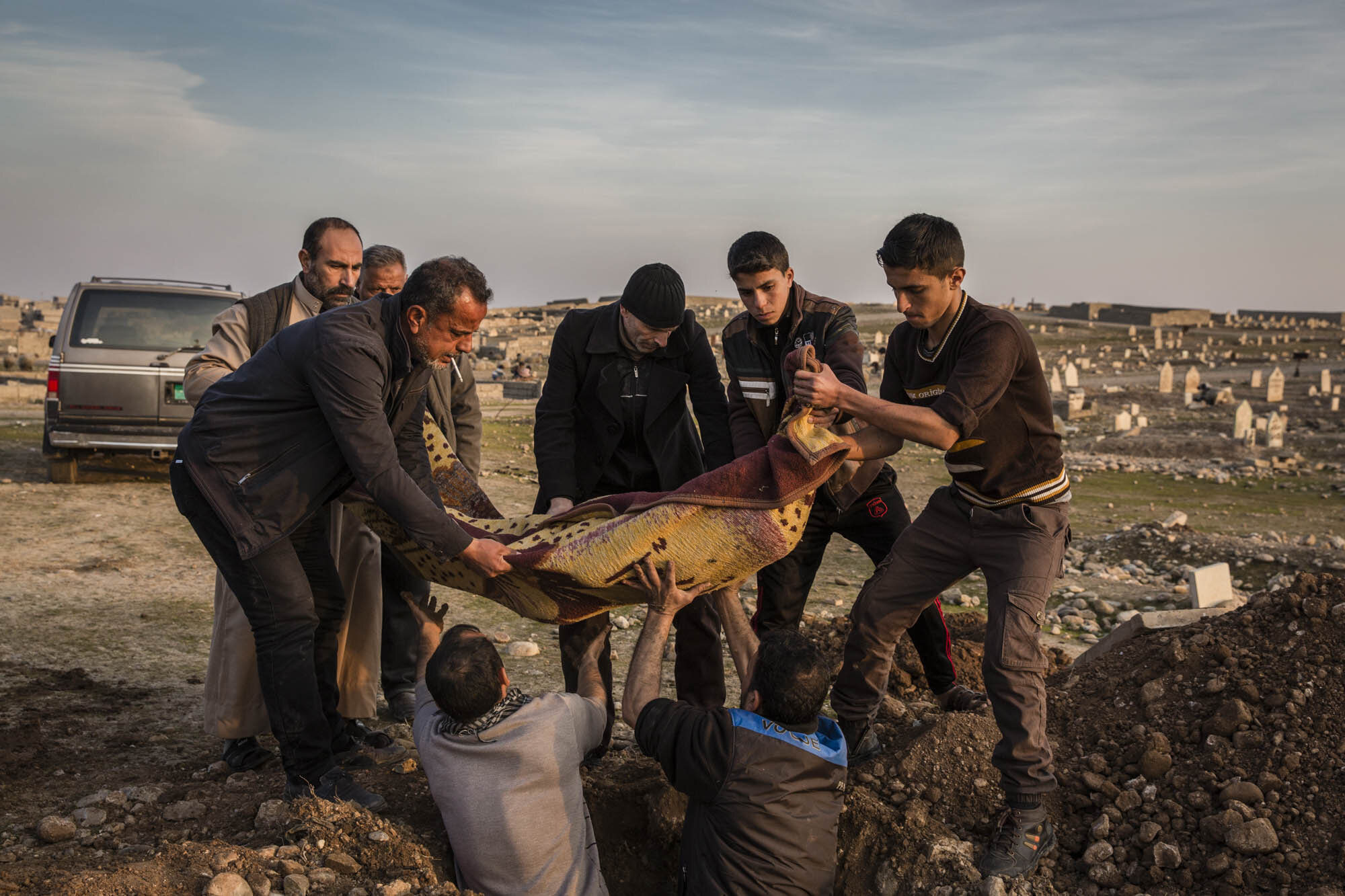  Zaid Khalid Mohammed, 16, was buried beside his father Khalid Mohammed Qassim, 42, at the cemetery in the Gogjali suburb of Mosul. They were killed earlier that day when an bomb laid by ISIS militants went off near their home in east Mosul. Iraq - J
