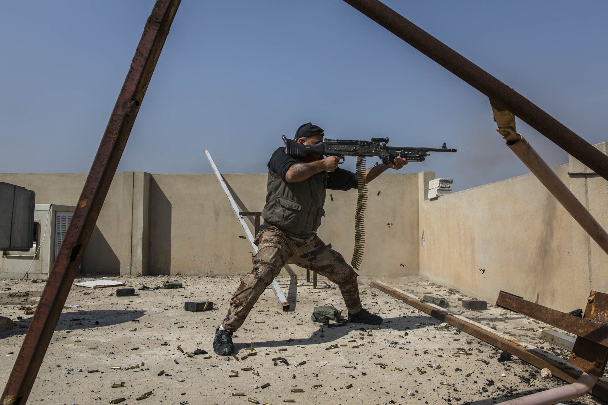  An Iraqi special forces soldier fired on ISIS positions from a rooftop on the frontline in the Shuhada neighbourhood of west Mosul. Iraq - March 2017 