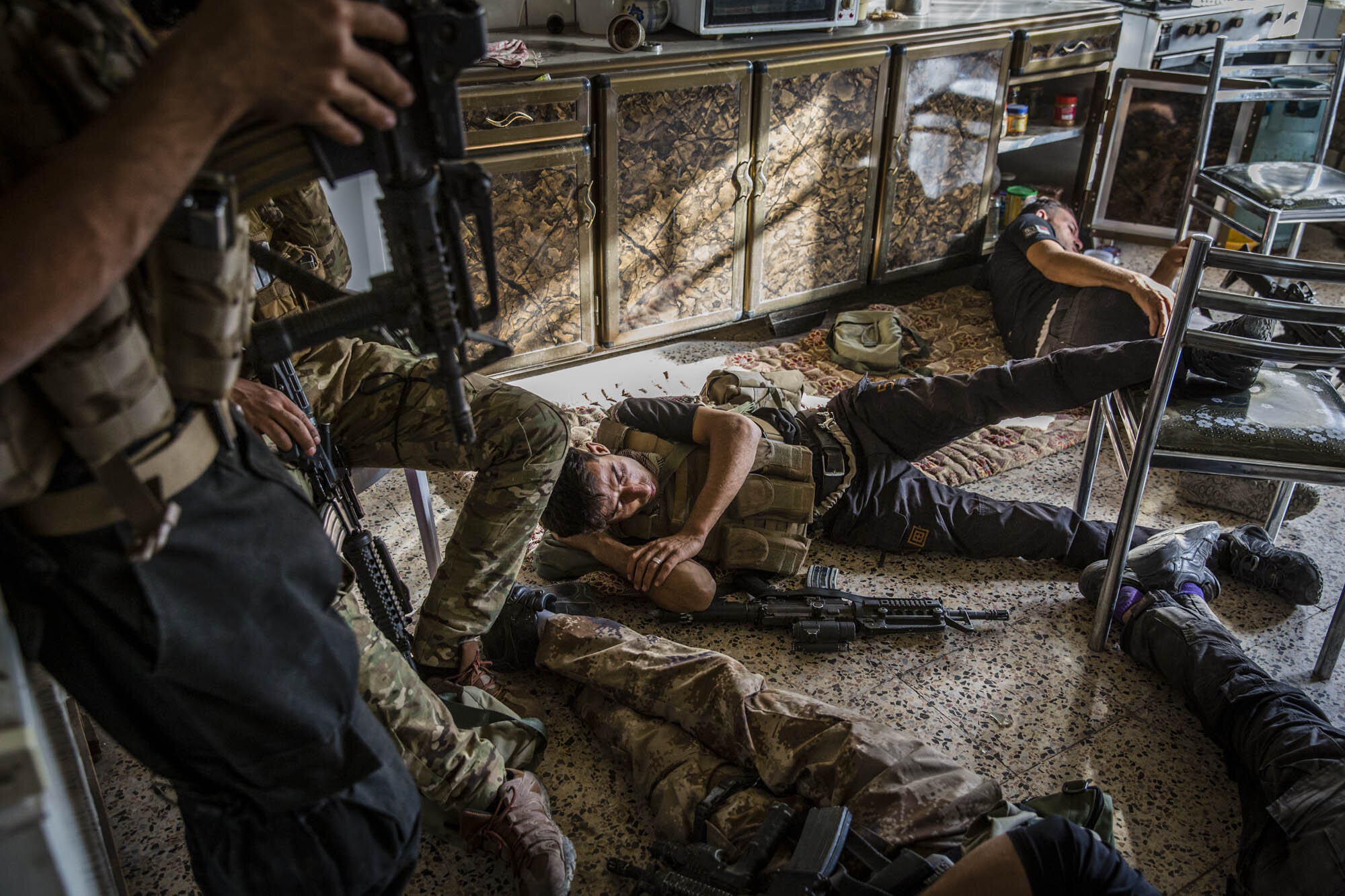  Iraqi special forces soldiers rested as they assembled early in the morning before going on an offensive to clear the Saha neighbourhood of west Mosul. Iraq - May 2017 