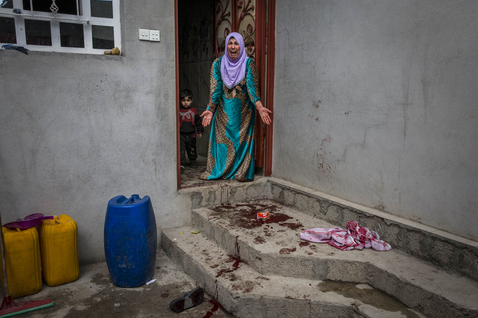  A woman screamed out in horror shortly after her son was killed in an ISIS mortar attack in the Jadidah neighbourhood of west Mosul. Iraq - March 2017 