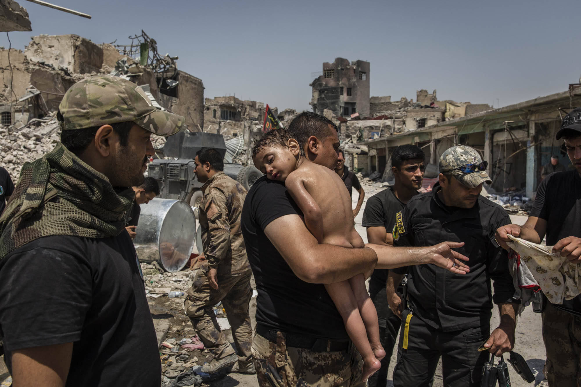  An unidentified young boy who was carried out of the last ISIS controlled area in the Old City, by a man suspected of being a militant, was cared for by Iraqi Special Forces soldiers. Iraq - July 2017 