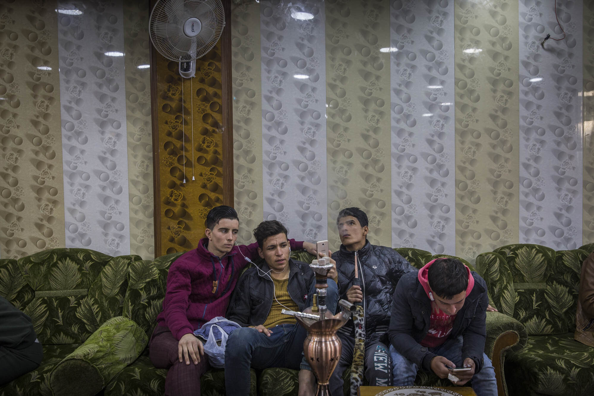  Less than 6 months after the end of the battle for Mosul, young men smoked hookah pipes and hung out at the recently opened Freedom Cafe in the west of the city. Iraq - December 2017 