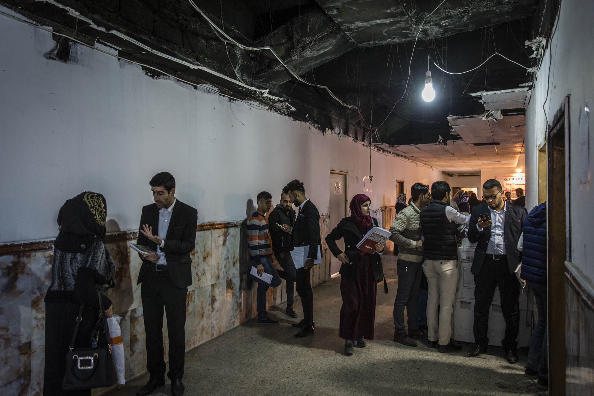  Students chatted and walked through a partially repaired section of Mosul university during lunch break. The prestigious university was badly damaged in the fight to retake the city from ISIS but students began to return as soon as the city was libe