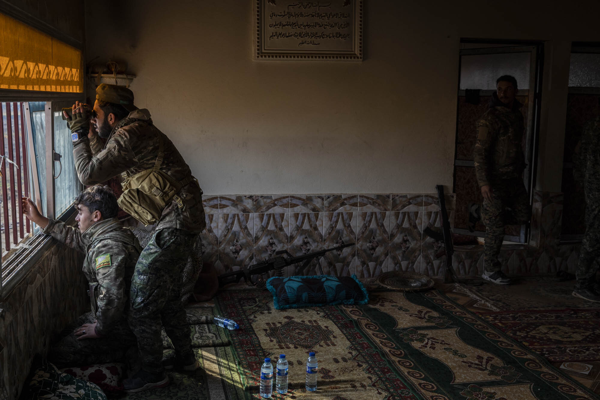  During a lull in fighting, Syrian Democratic Forces (SDF) soldiers monitored ISIS positions in the village of Baghuz, just days before the operation re-started.  