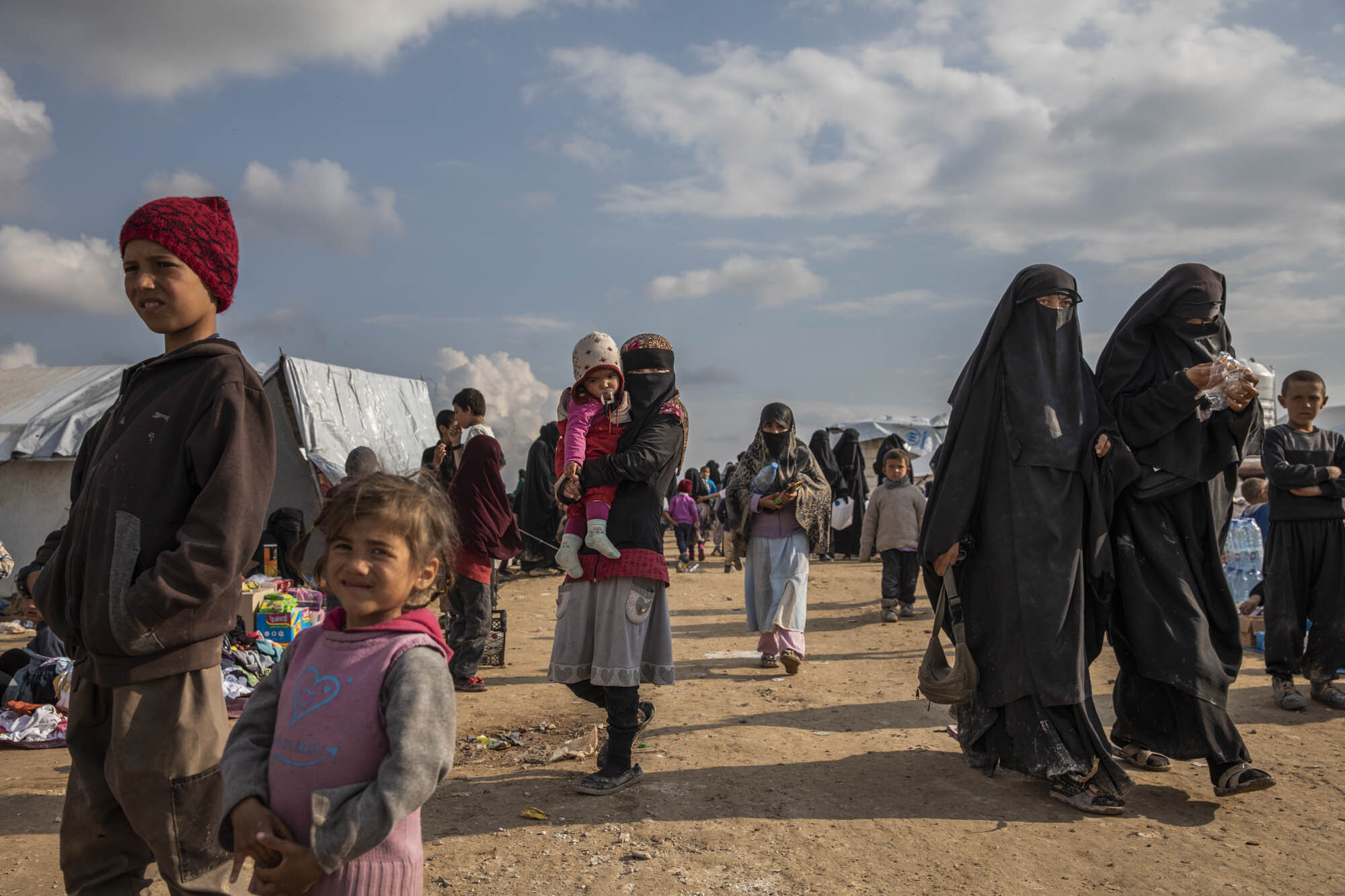  Women and children from all over the world, many of them suspected of being the wives and family members of ISIS militants, who had escaped the final months of the caliphate in south east Syria, moved around in the foreigners section at al-Hol deten