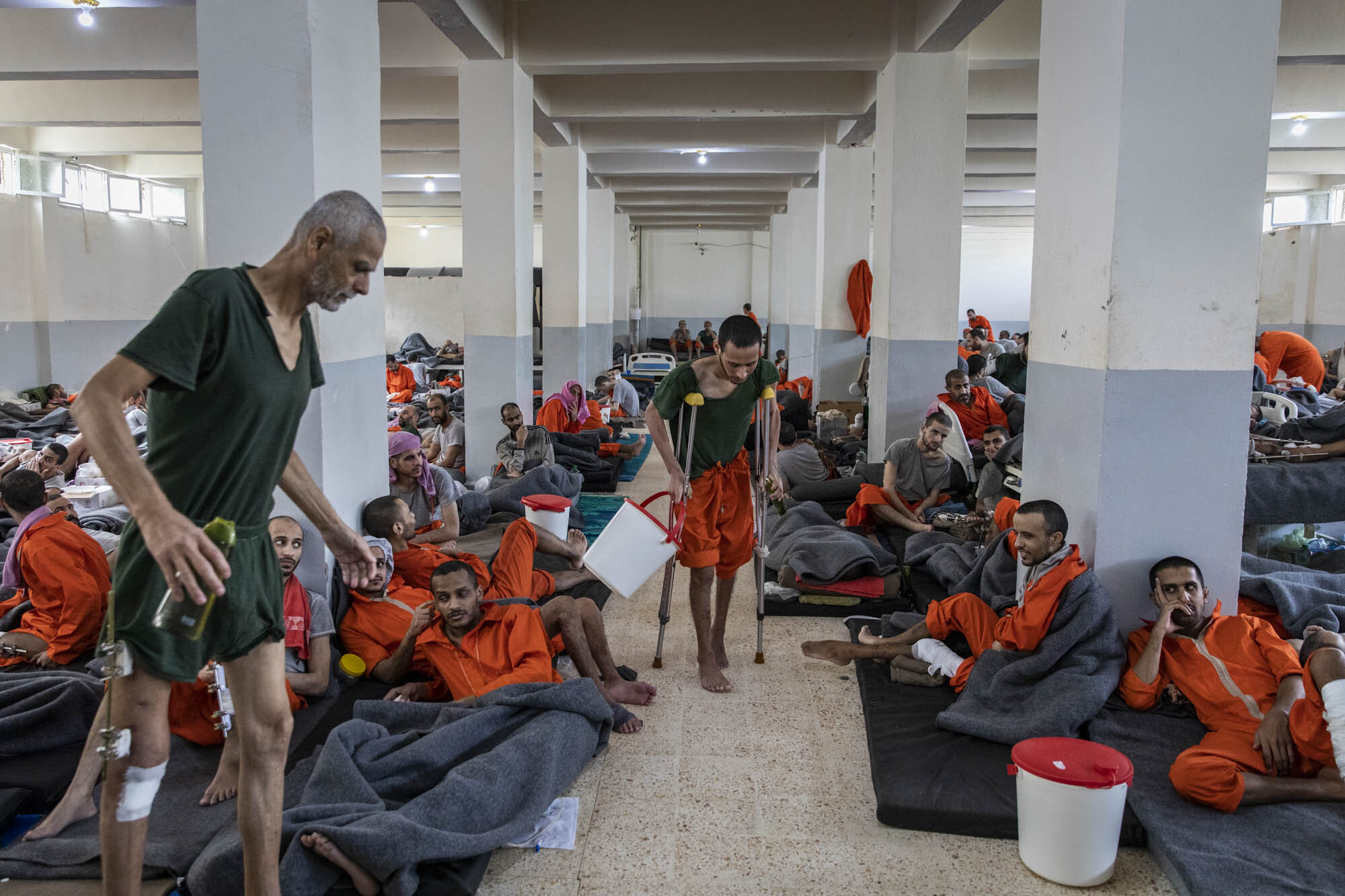  Men accused of being ISIS members, who were captured during the final months of fighting in south east Syria in early 2019, were crammed inside a large cell at a prison controlled by Kurdish forces in north east Syria. 