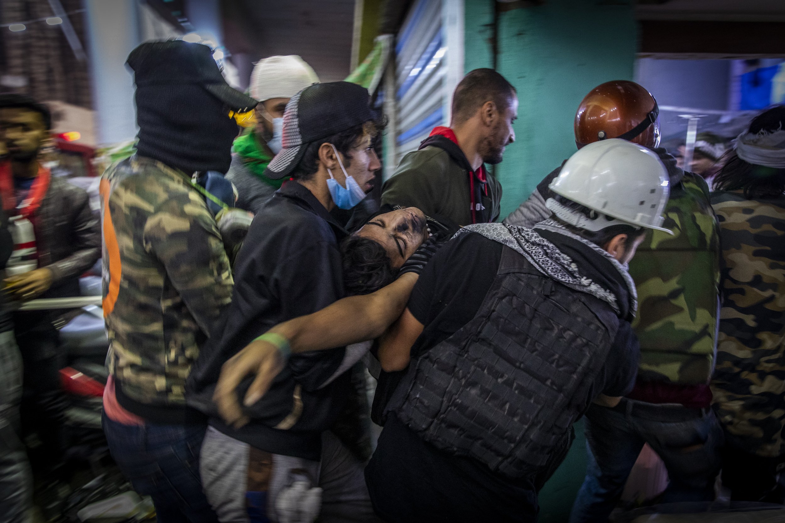  A badly injured protester was rushed to a first aid station shortly after being injured in clashes with security forces on Rasheed Street in downtown Baghdad. 