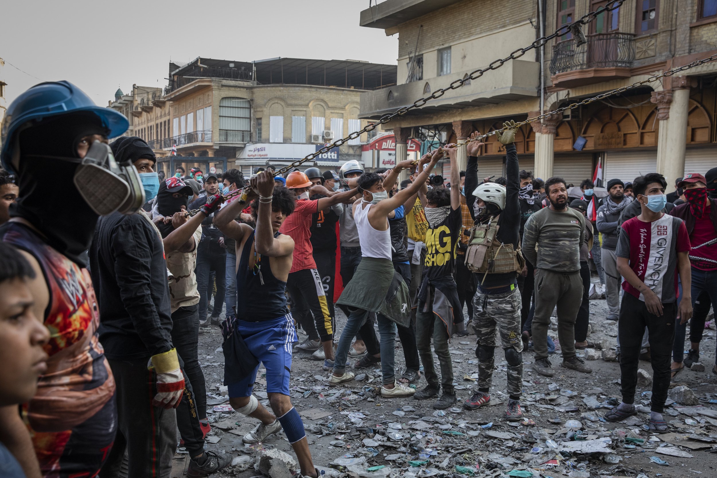  Young men attempted to pull down blast walls on Rasheed Street in Baghdad, during clashes with Iraqi security forces nearby.  