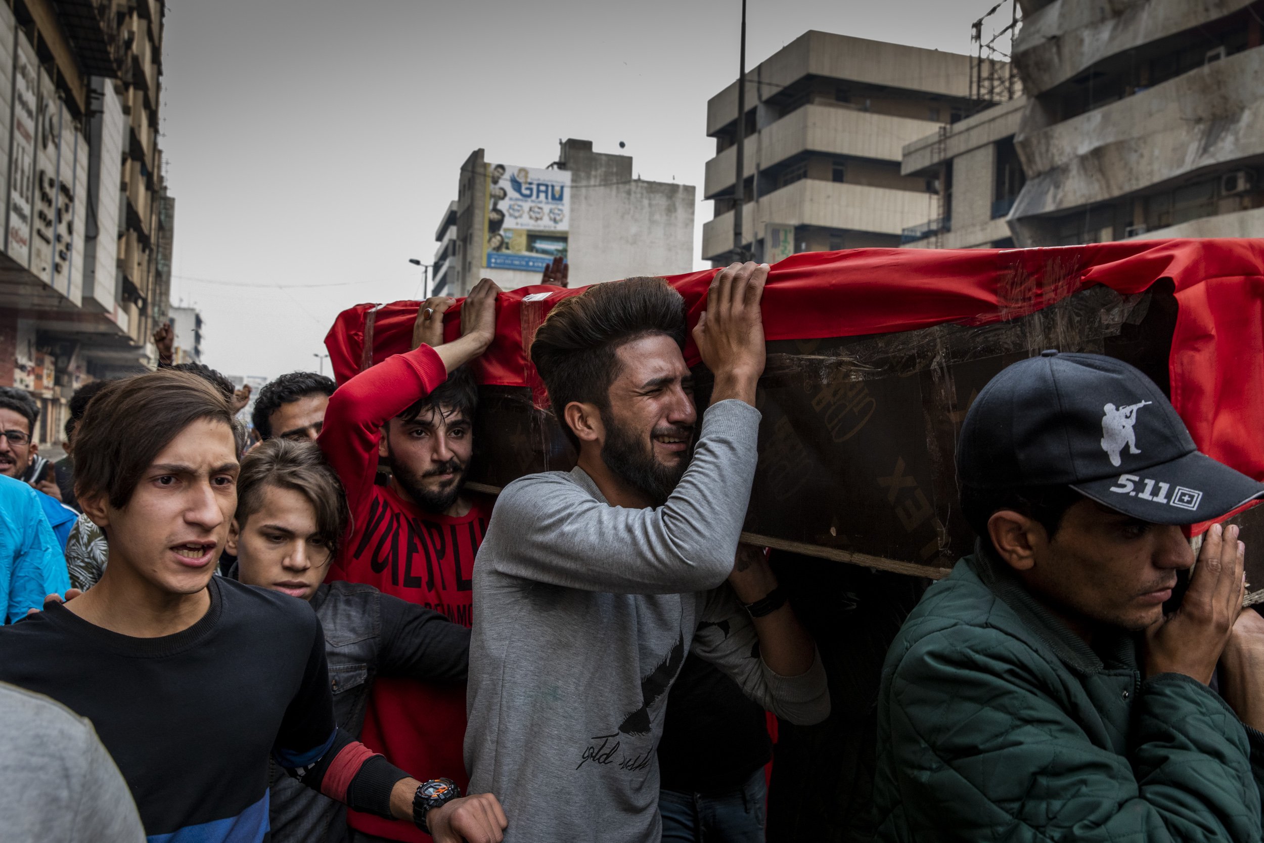 Friends and family members paraded the coffin of 16-year-old Hussein Abed, who was killed by Iraqi security forces , through the streets of Baghdad.