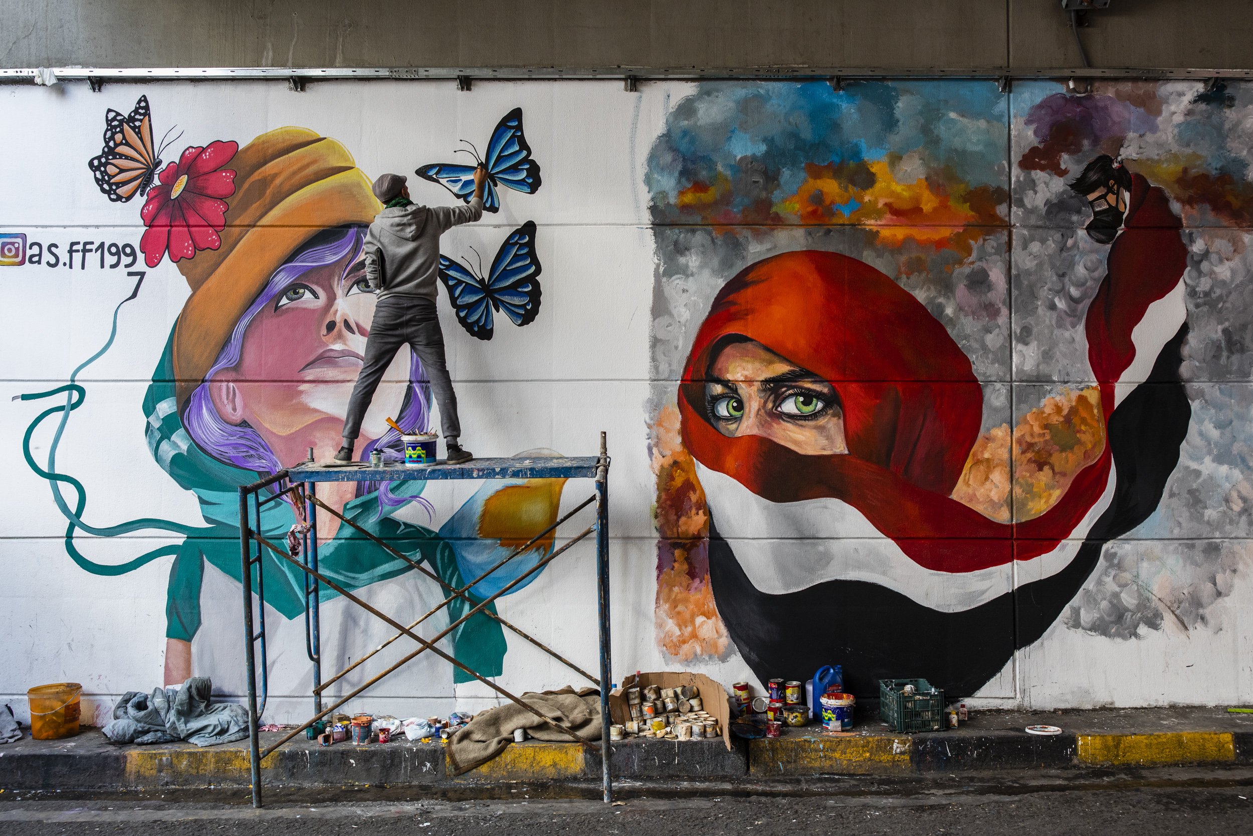  An anti-government protester painted a mural on Sadoon Street in downtown Baghdad. 