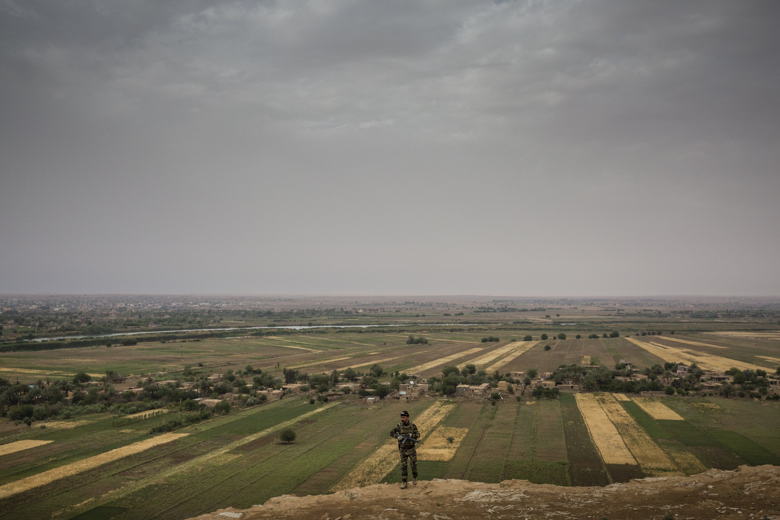  Iraqi border guard troops looked out across the border with Syria near the Syrian town of Abou Kamal, where some remaining elements of ISIS are hiding out trapped between various Syrian factions and the Iraqi border.  