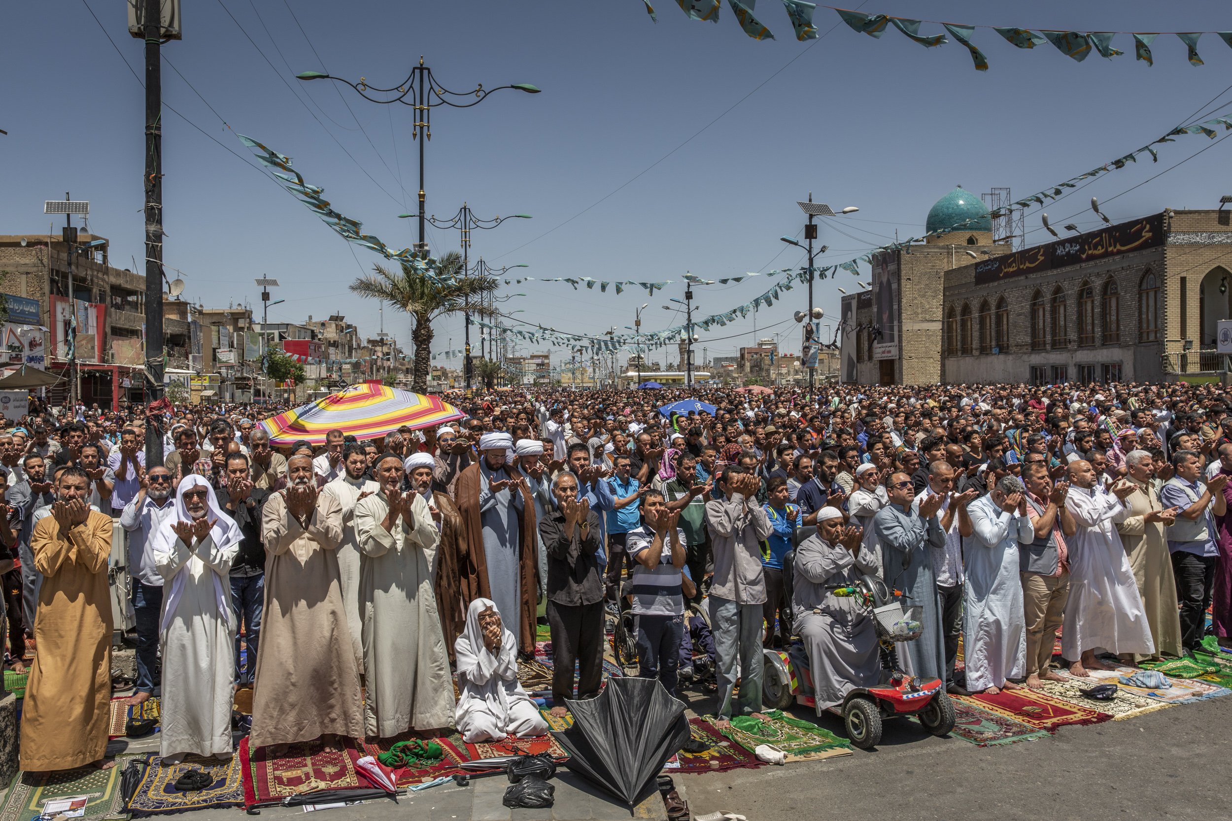  Thousands prayed in front of the al Muhsen mosque in Sadr City, the predominantly Shiite enclave in Baghdad, on the eve before general elections in 2018. 