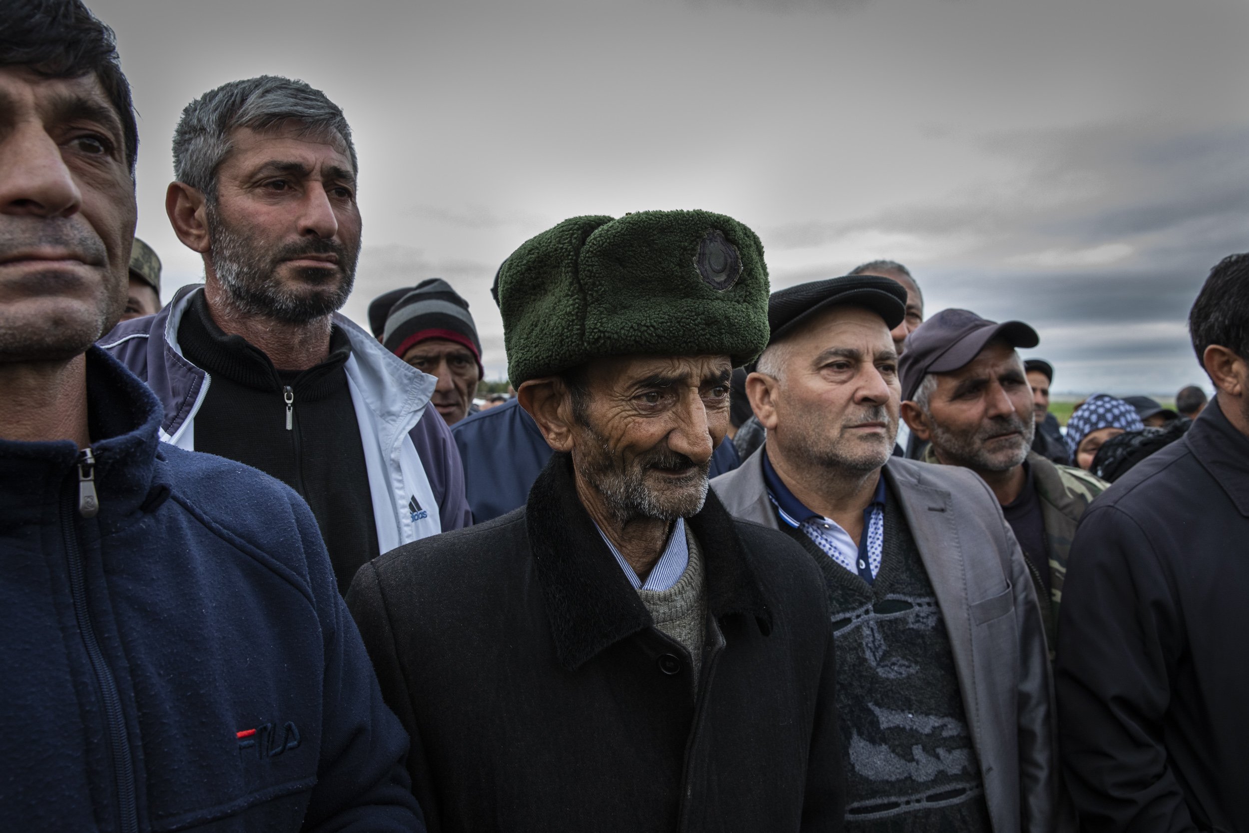  Friends and family members looked on as the body of Amar Isakli was taken away to be buried at the nearest cemetery in the frontline city of Terter.  