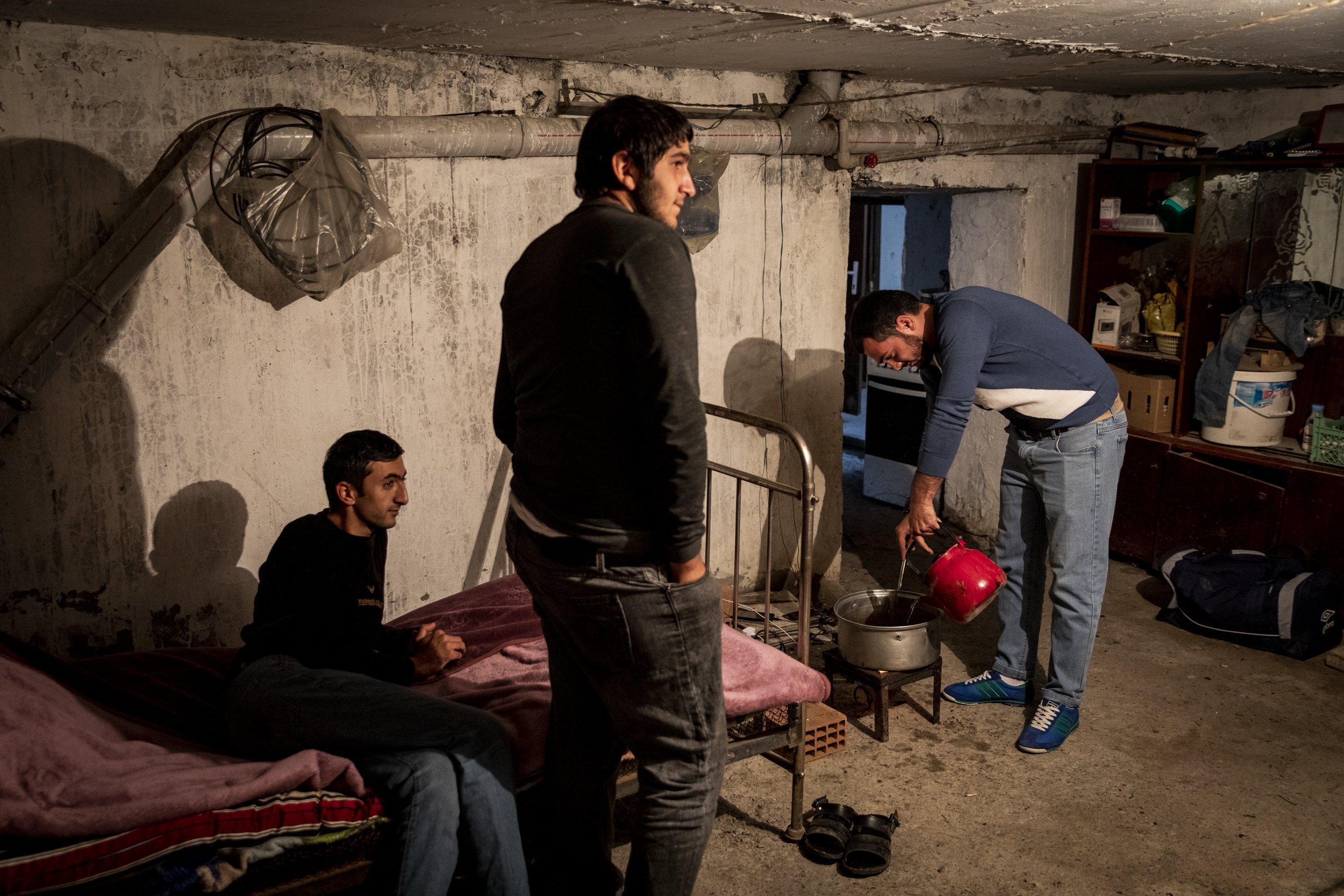  Fazil Ibadli cooked lunch for his family members and neighbours who he shares a basement bomb shelter with in the frontline town of Terter. Most of the women and children have been evacuated from such areas and some men have remained to keep an eye 