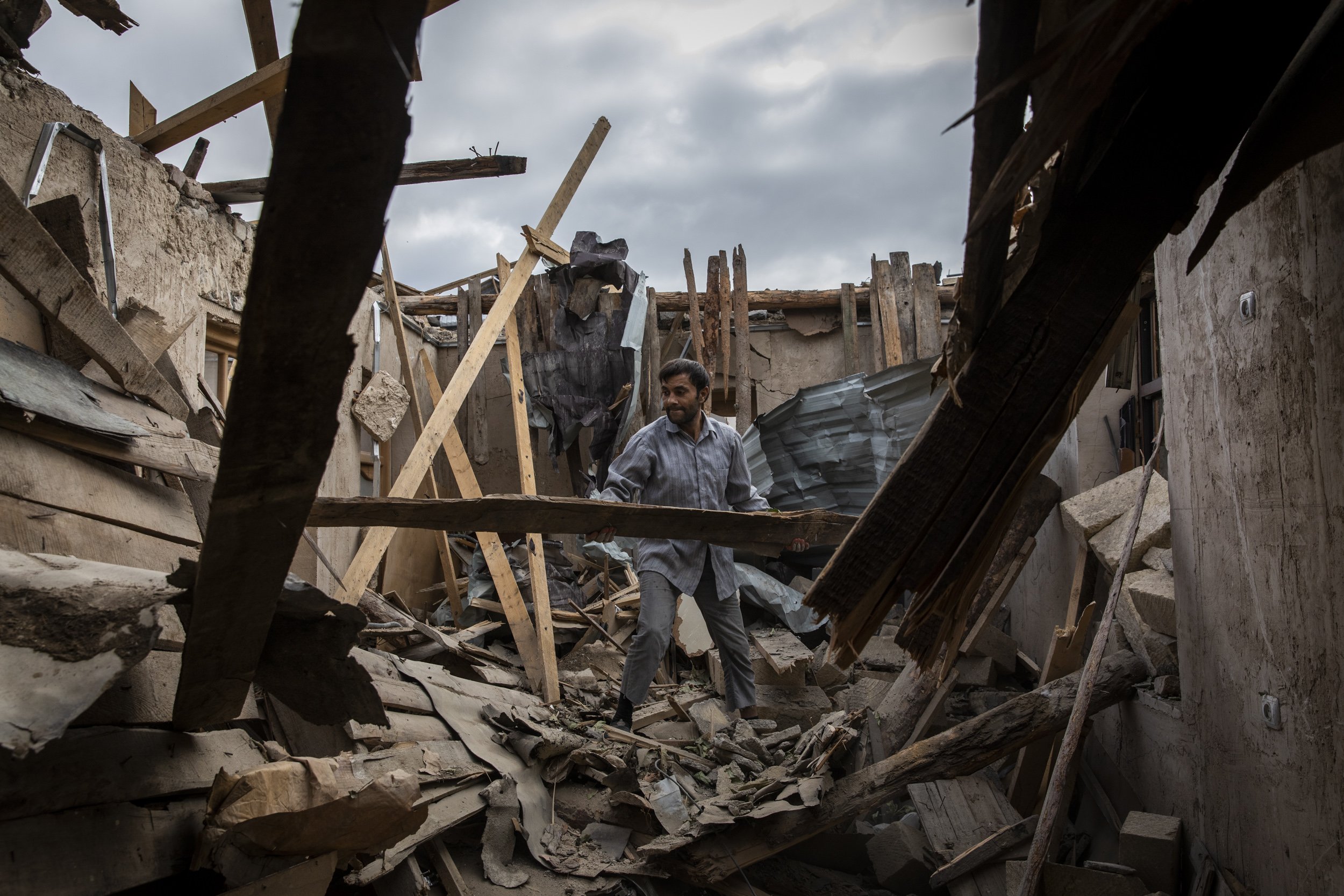 Ali Ibrahimov, 40, began to clear his destroyed home in the Cevathan neighbourhood&nbsp;of Ganja, Azerbaijan’s second largest city. The residential area was hit by a Scud missile fired by Armenian forces on the the 17th of October. The strike killed