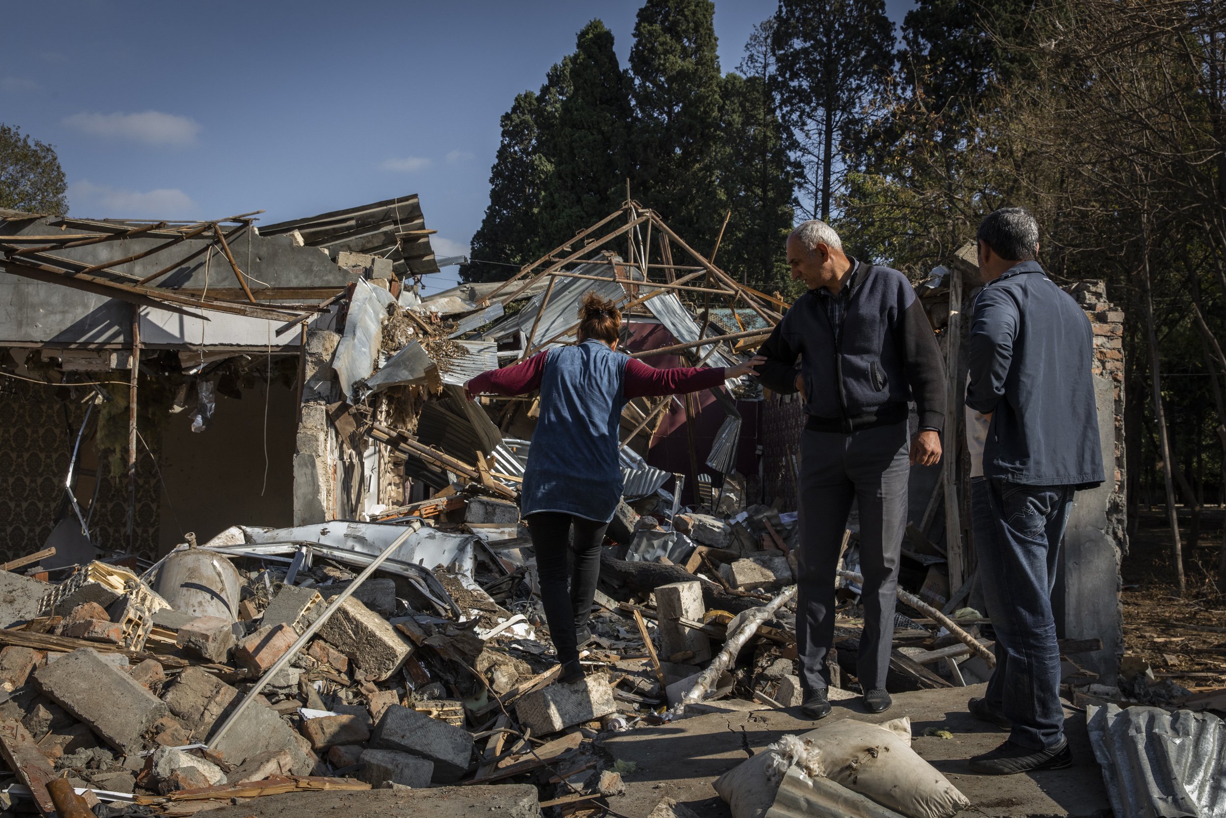  A family surveyed their destroyed home in Vardeni neighbourhood of the city of Ganja, Azerbaijan’s second largest city. The residential area was hit by a scud missile fired by Armenian forces on the the 10th of October. The strike killed 10 civilian