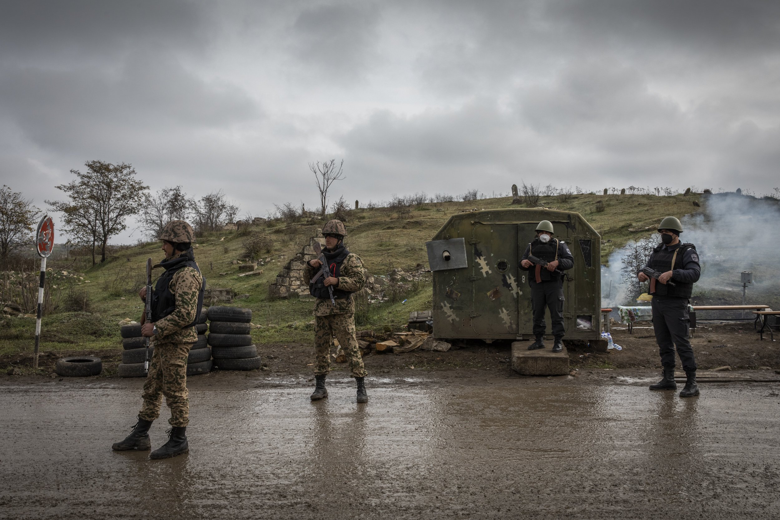  Azerbaijani soldiers and police officers manned a checkpoint on a road outside the recently recaptured town of Fizuli, one of several districts surrounding Nagorno Karabkah that Azerbaijan reclaimed.  