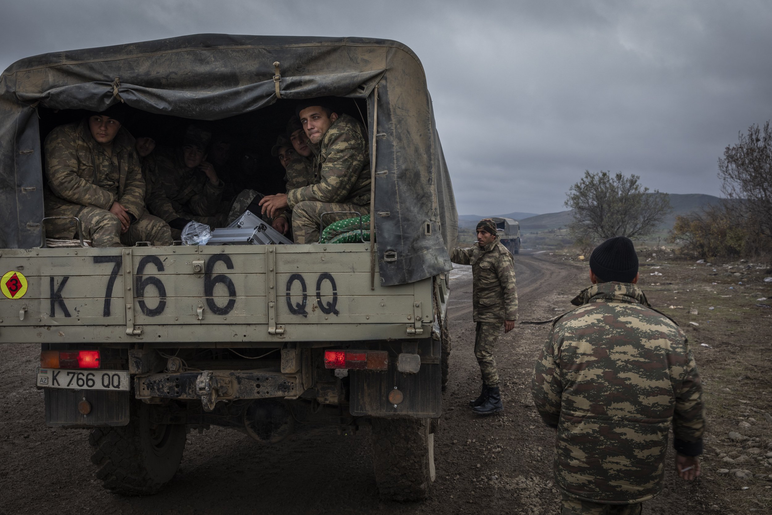  Azerbaijani troops returning from the frontline stopped on the side of the road outside the town of Fizuli. 