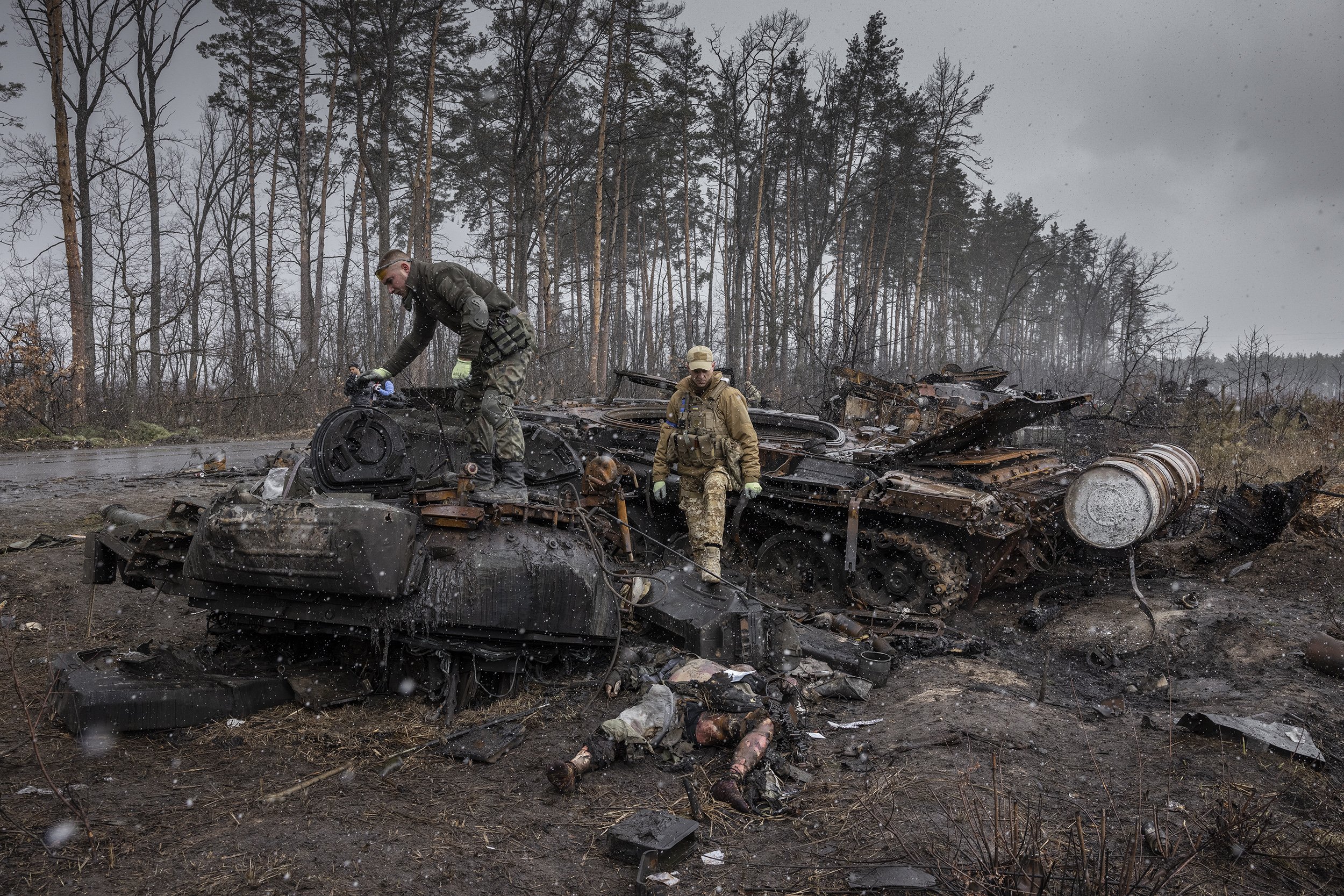  The burnt corpse of a 22-year-old Russian soldier was retrieved from the destroyed remnants of a tank on the western outskirts of Kyiv. Russian forces were driven from the area just 2 days before, as they abandoned their attempt to take the capital 