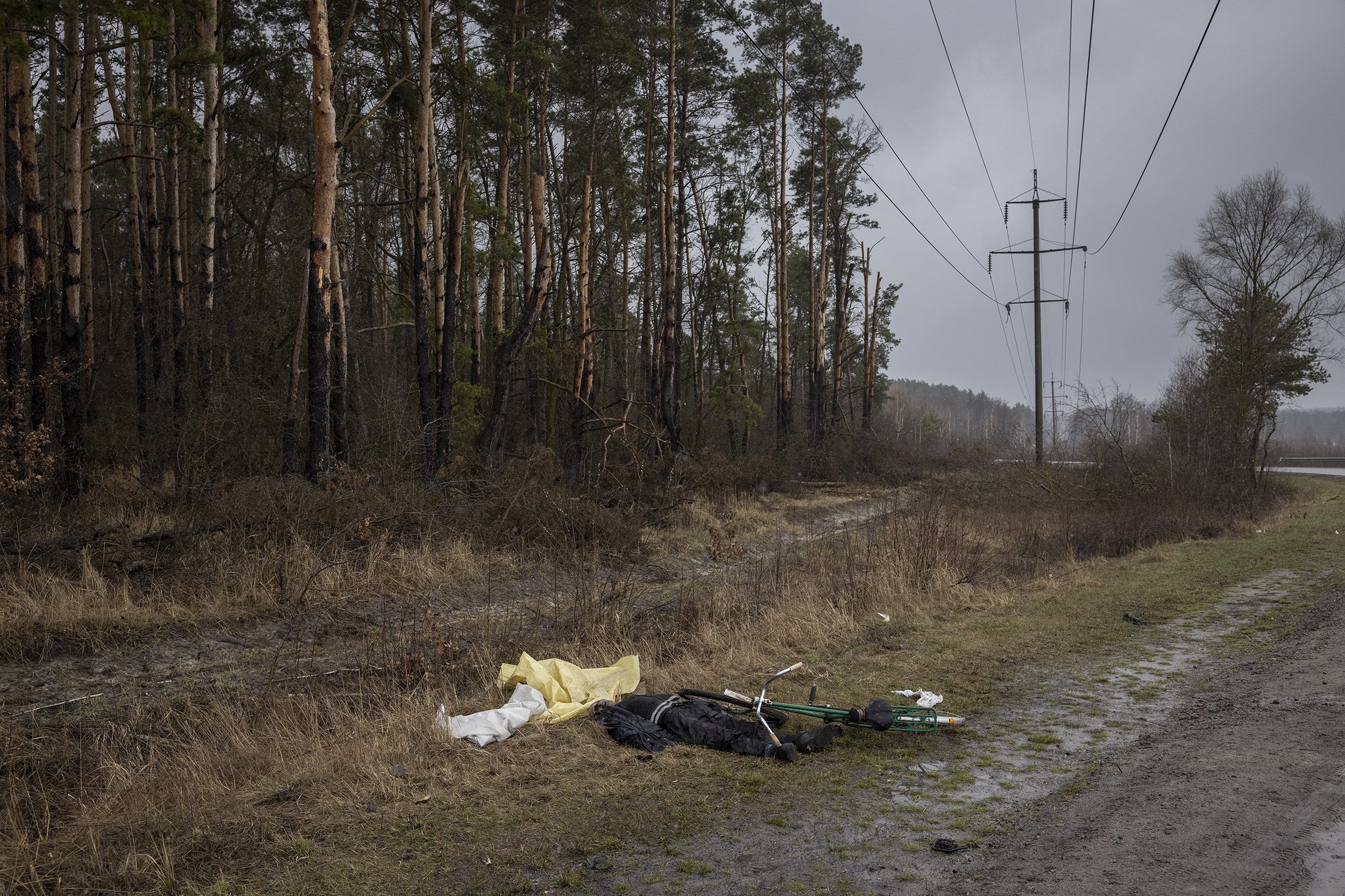  The body of a middle aged man, with a gunshot wound to the head, lay on the side of the road just outside the town of Bucha. Russian troops are thought to have killed hundreds of unarmed civilians during their month long occupation of the area. Apri