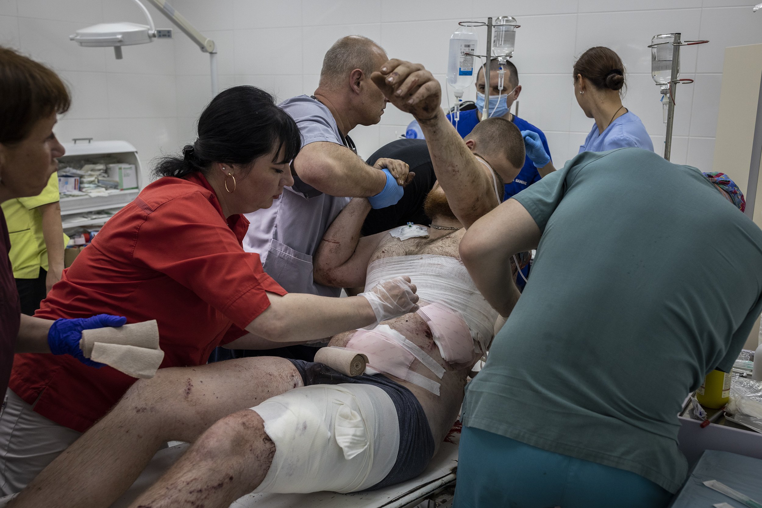  Medics at a hospital in Sloviansk worked to stabilise a Ukrainian soldier who had been wounded in the leg and torso by shrapnel from a Russian artillery strike. June, 2022. 