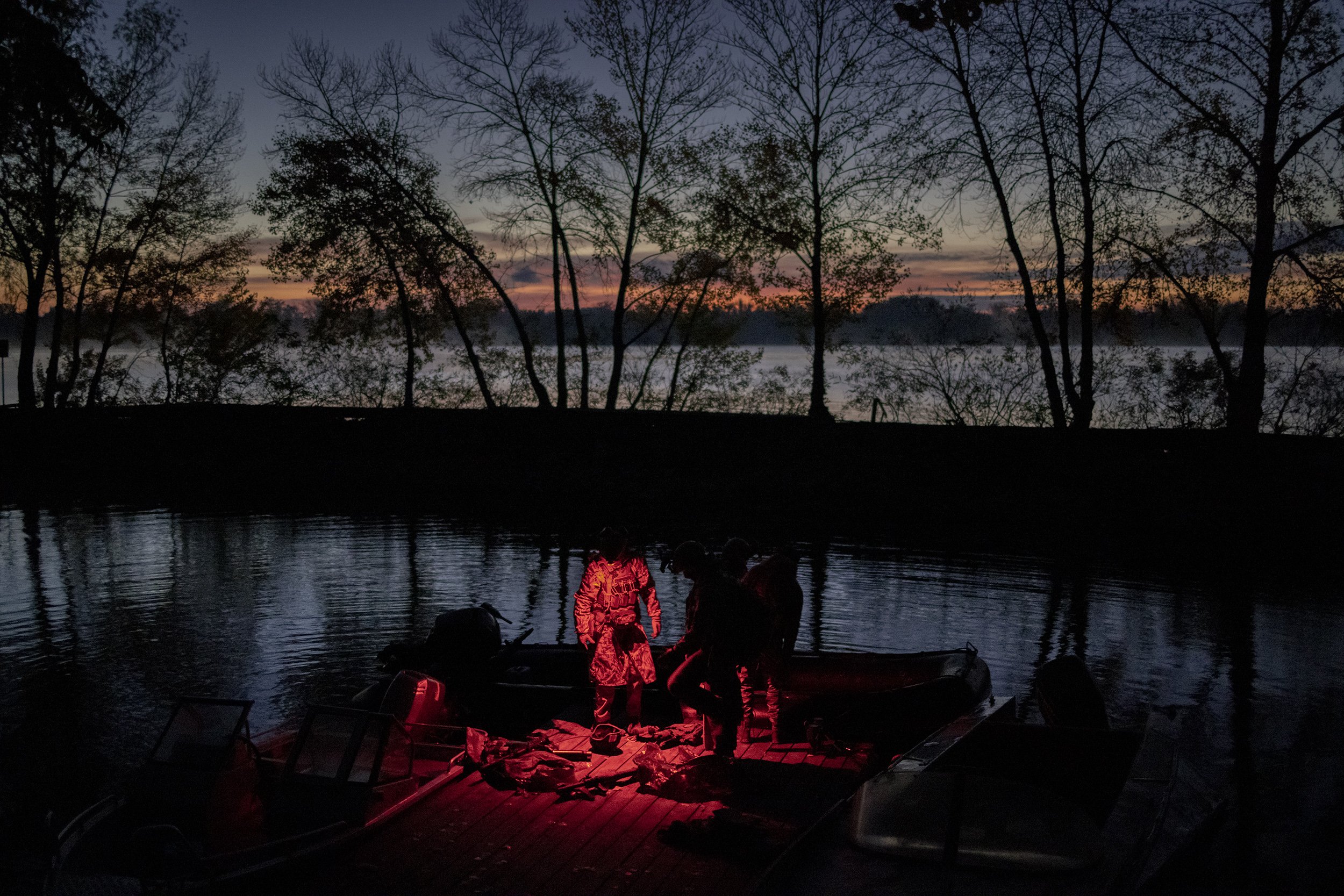  Members of a special forces unit of the Bratsvo battalion, returned after conducting a night time operation targeting Russian forces behind the frontline, along the banks of the Dnipro river in southern Ukraine. October, 2022. 