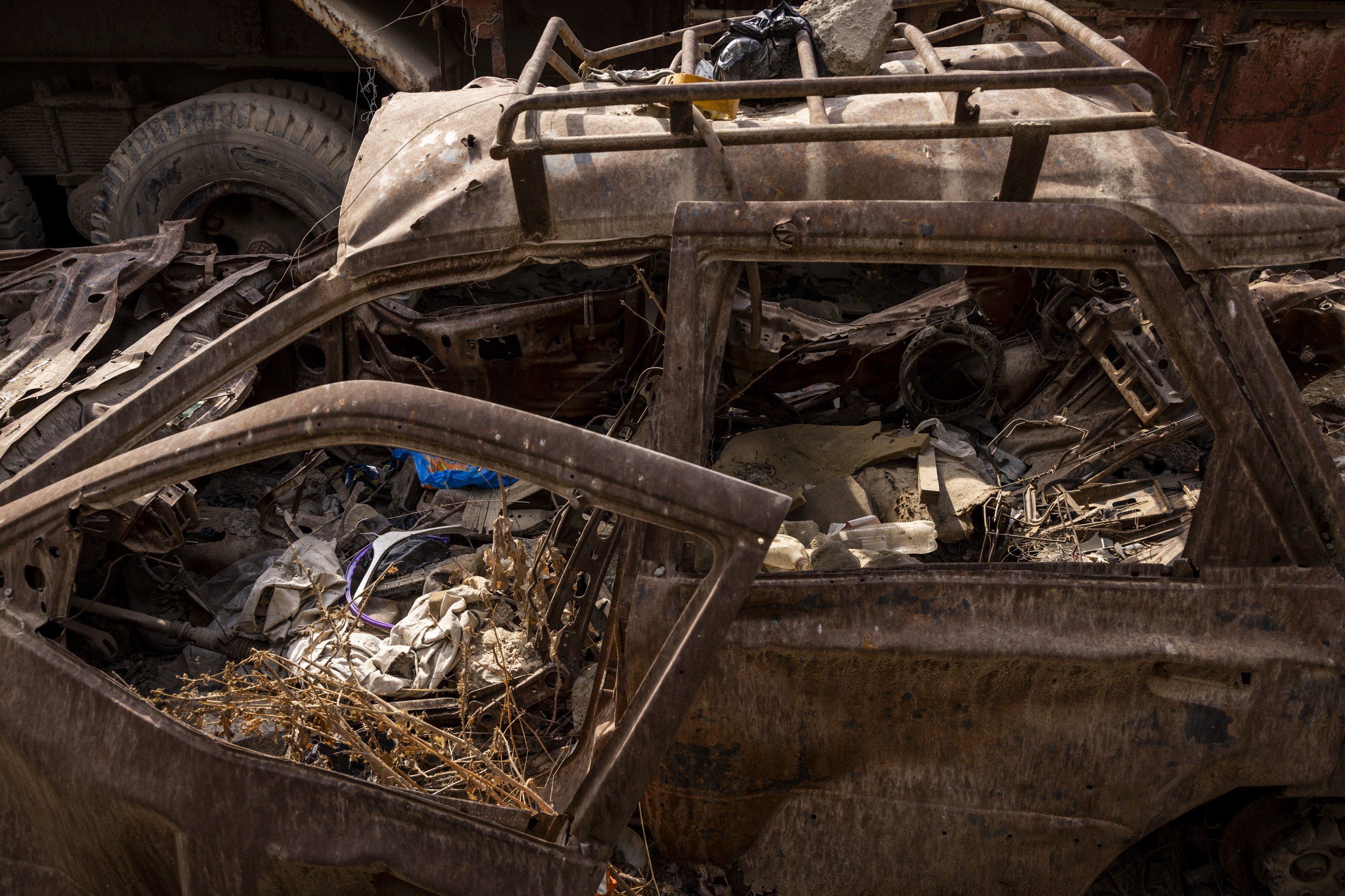  The remnants of the car Younes and family were in in when they were hit lays rusting near the site of the attack.  