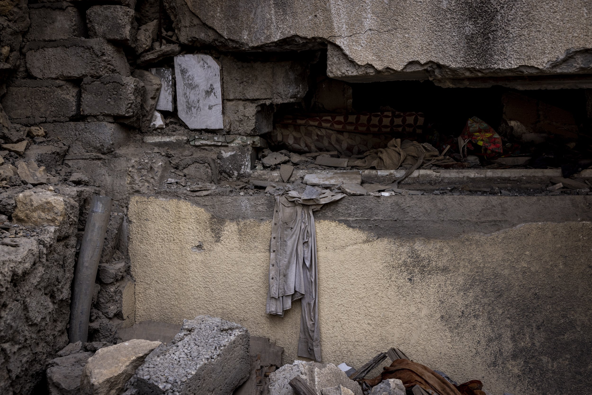   A shirt lay amid the rubble of the house where Rafi al-Iraqi and his family were living when it was hit by an airstrike. 