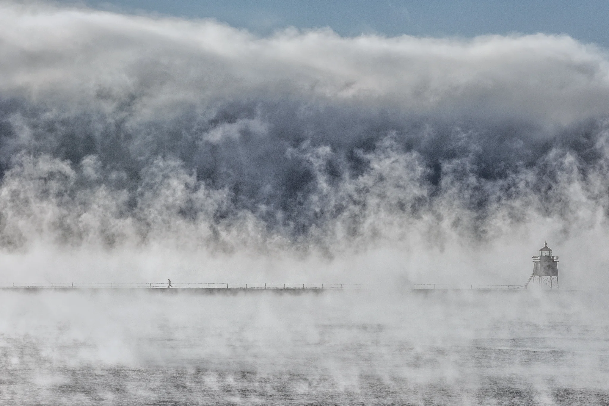 Sea smoke rises off the harbor and around the lighthouse at Two Harbors on a -15 degree morning.