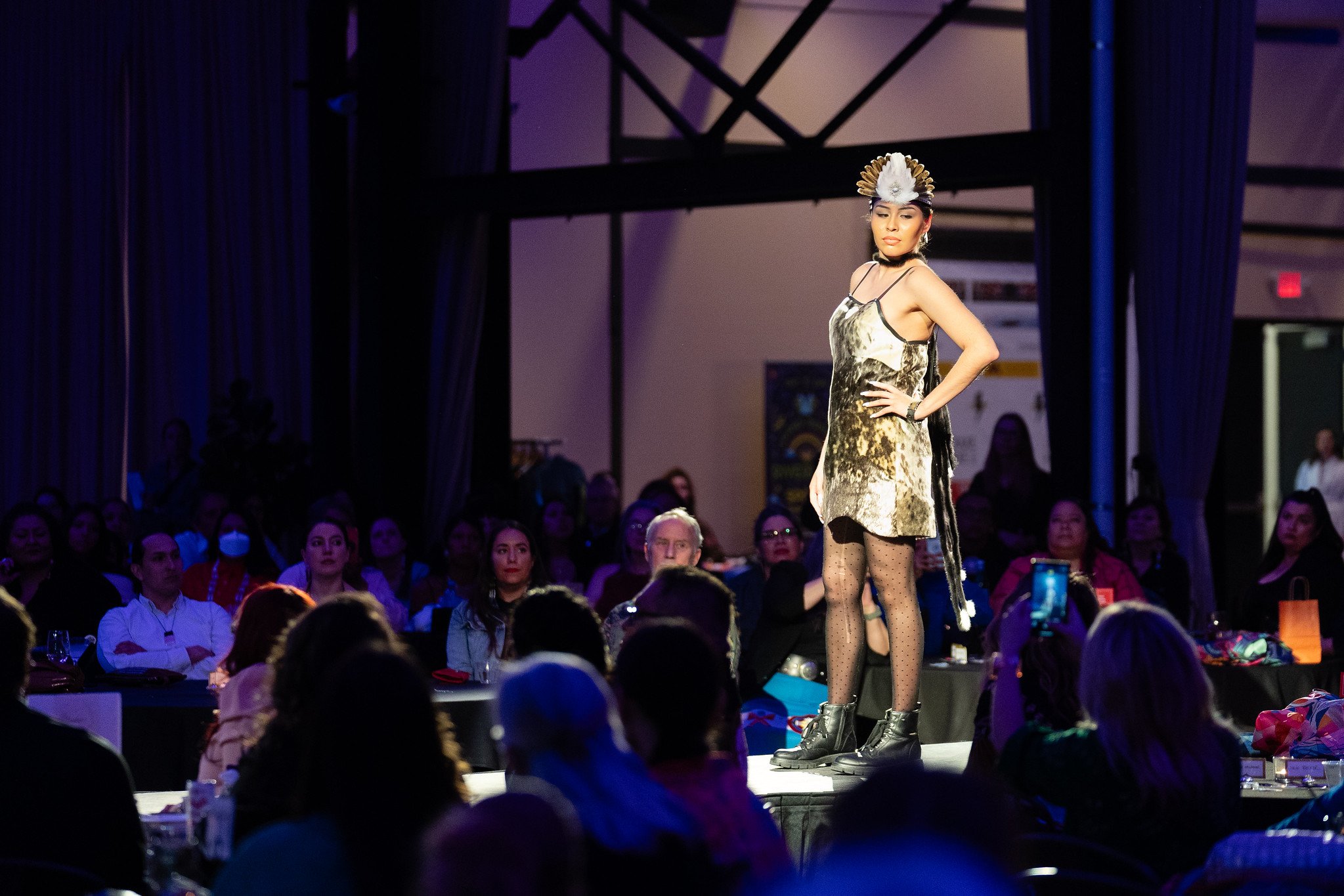 A model wearing a piece by Christy Ruby on the runway at Native Nations Fashion Night in Minneapolis